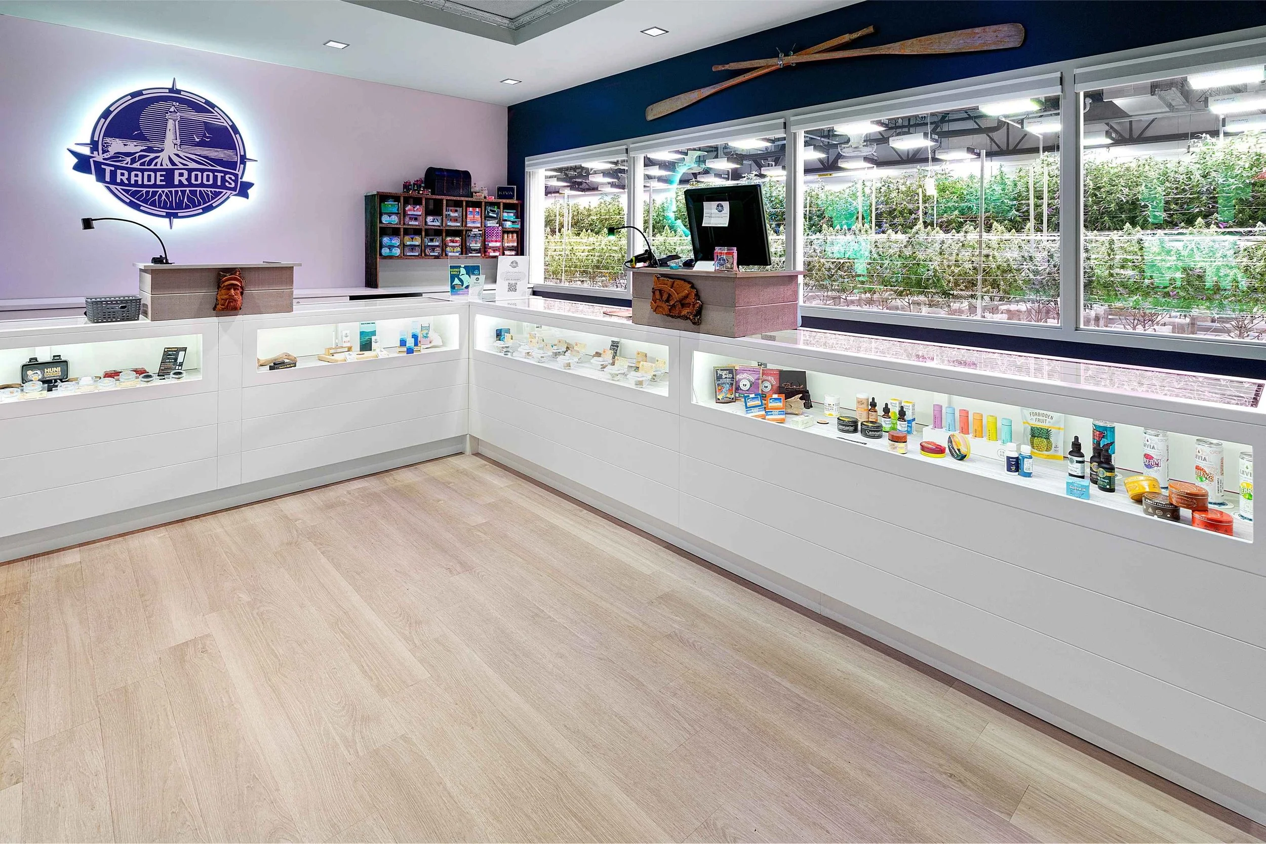 Former Trade Roots dispensary interior with POS and with cultivation window for the customer to see first-hand cannabis cultivation