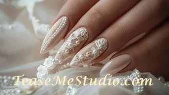 Close-up of a hand with intricately decorated white lace and pearl nail art on long, almond-shaped nails.