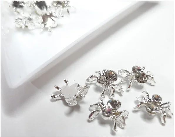 Silver Spiders with clear gem