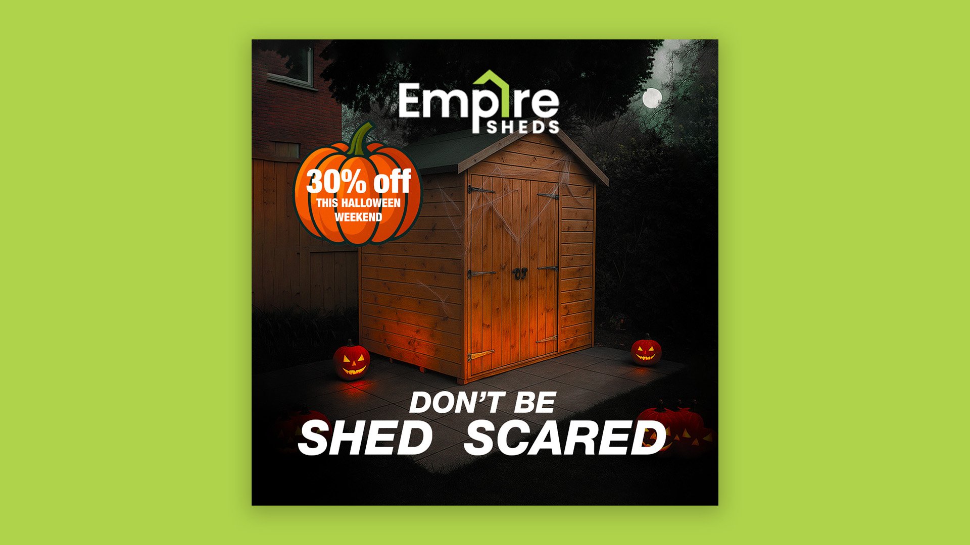 A wooden shed decorated for Halloween with carved pumpkin lights and a sign offering 30% off for Halloween weekend, set against a dark, spooky night.