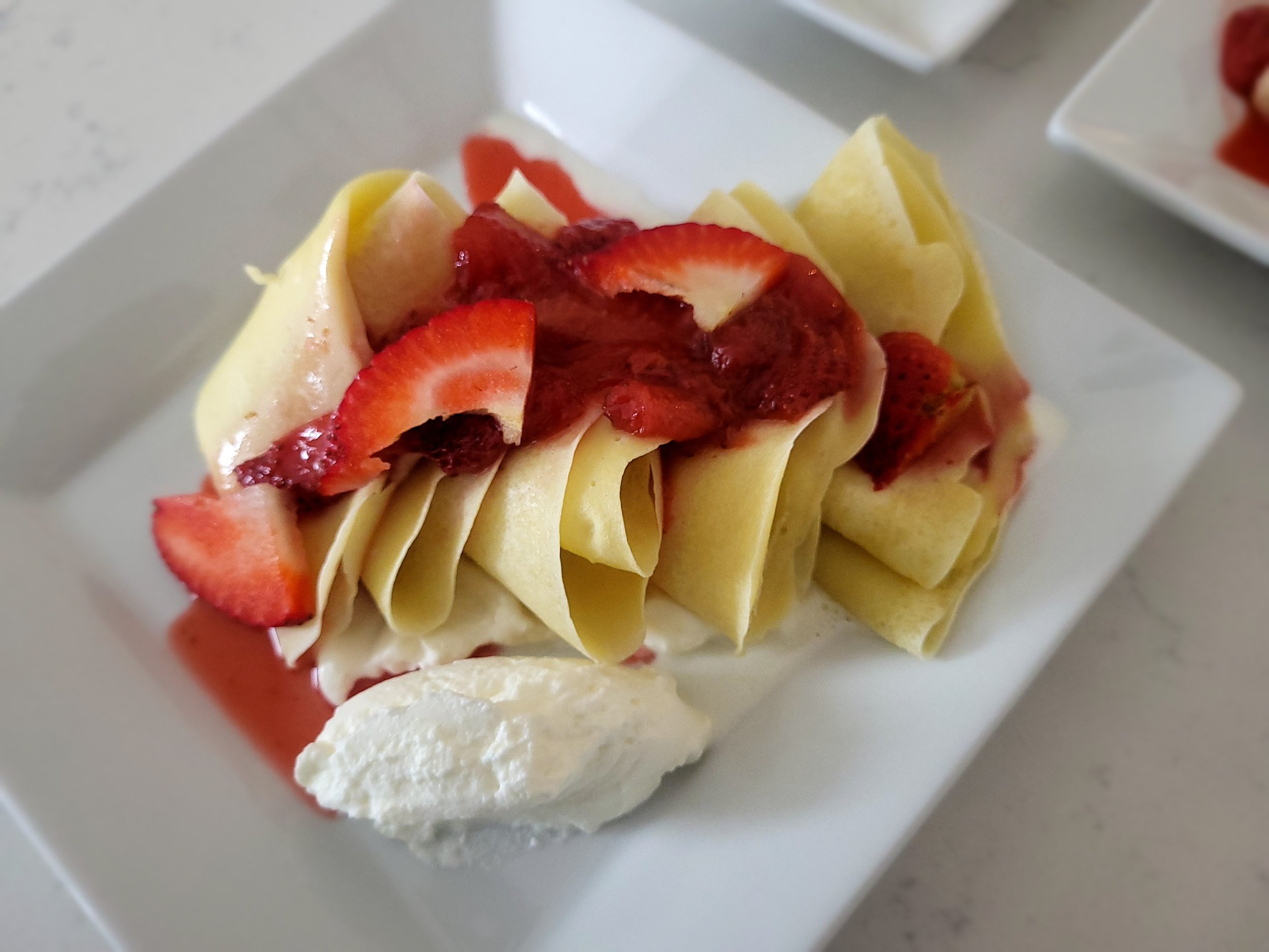 crepes w/ fresh strawberry compote and chantilly cream