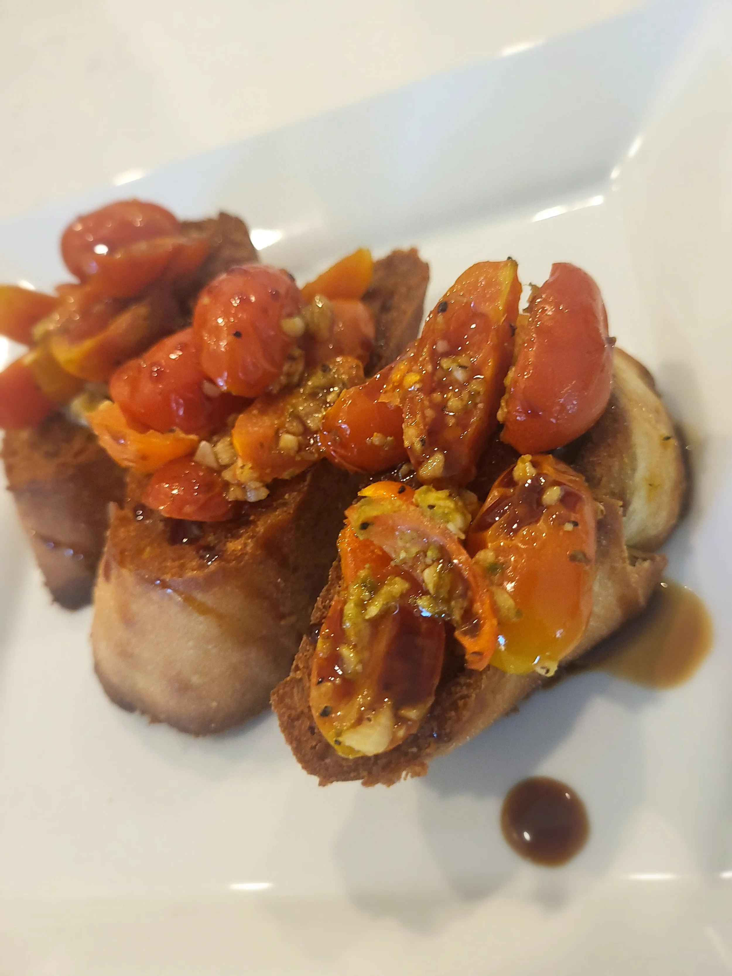 Roasted cherry tomato bruschetta w/ balsamic reduction