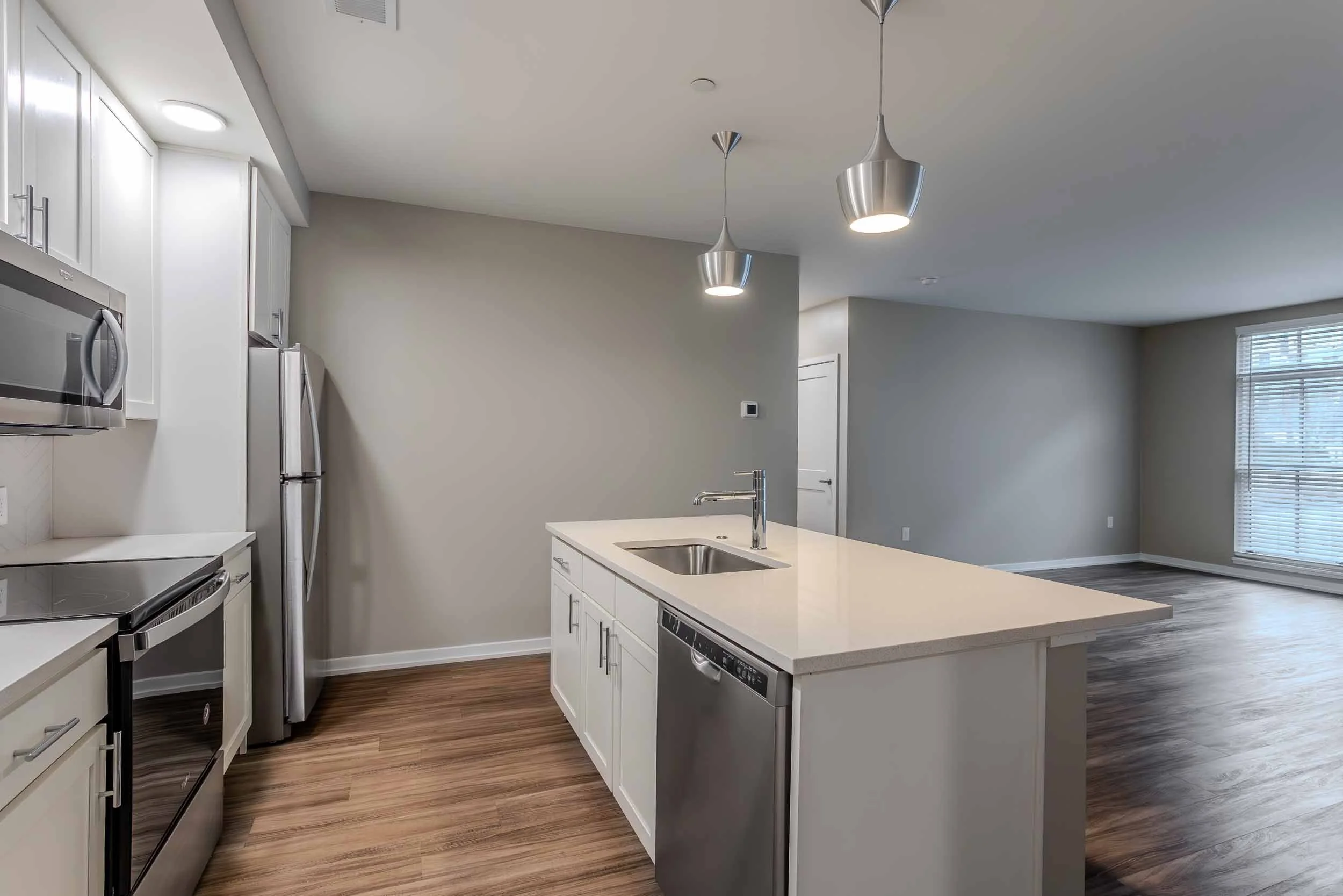 The Residences at The Sutton | Short North Apartments in Columbus, OH | Kitchen and Living Room