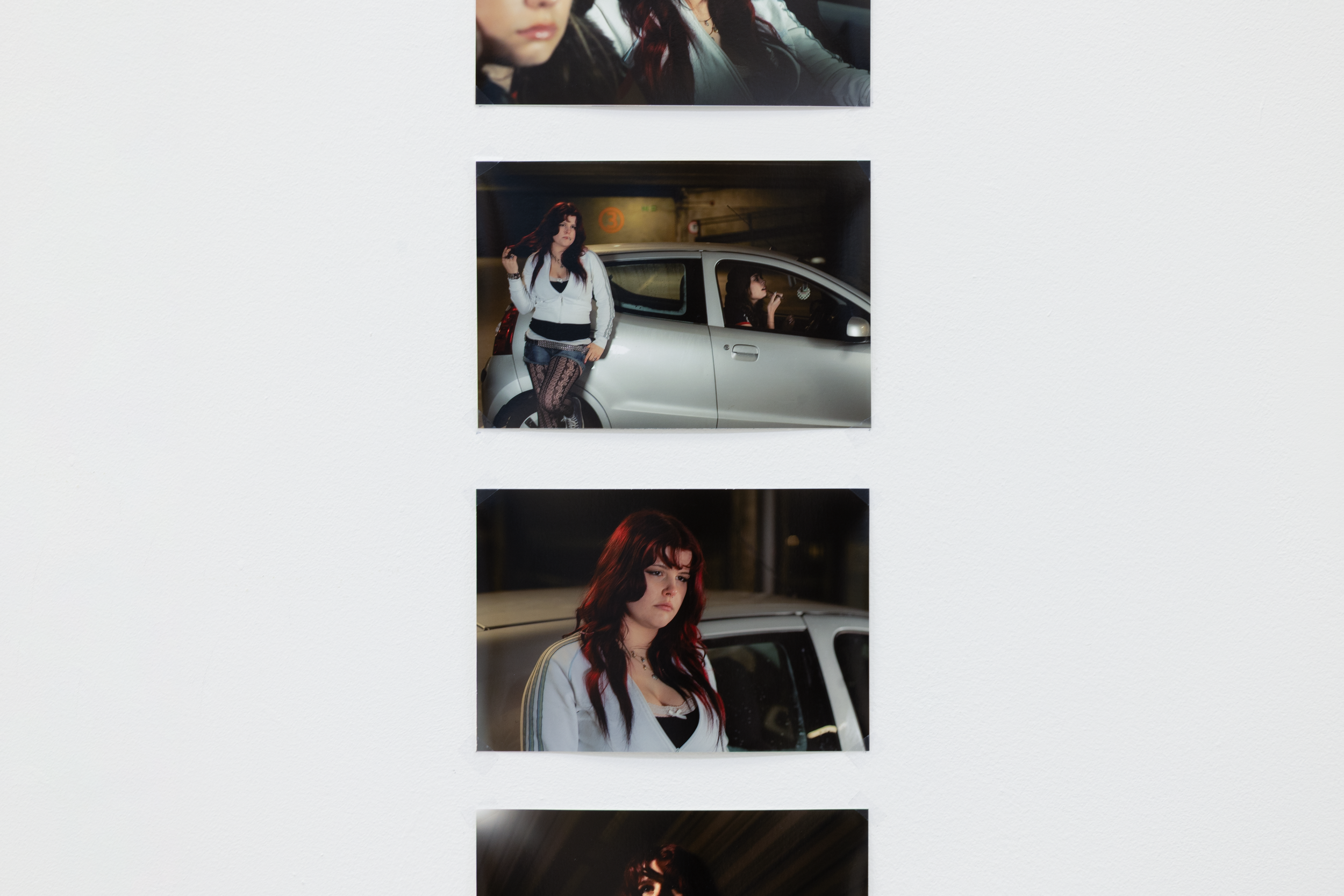 A series of five photographs of a young woman with dark hair and red highlights posing next to a car and in different settings.