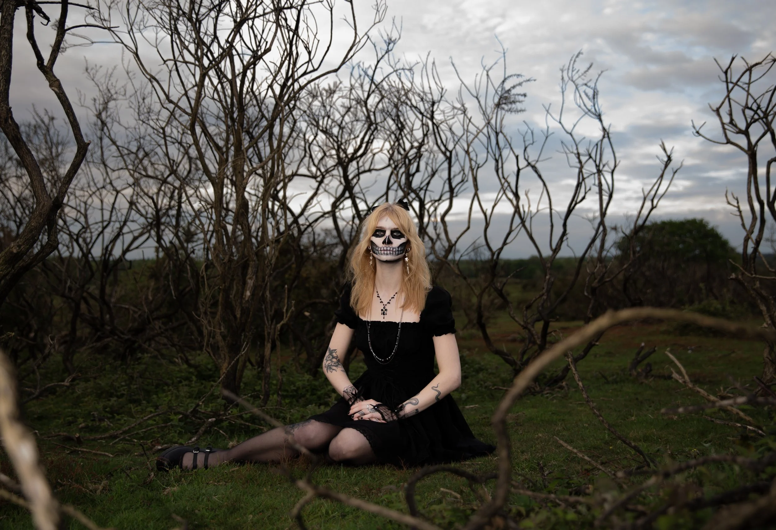 Surreal Photography including a woman in skeletal makeup around a grave. Fashion Editorial Style