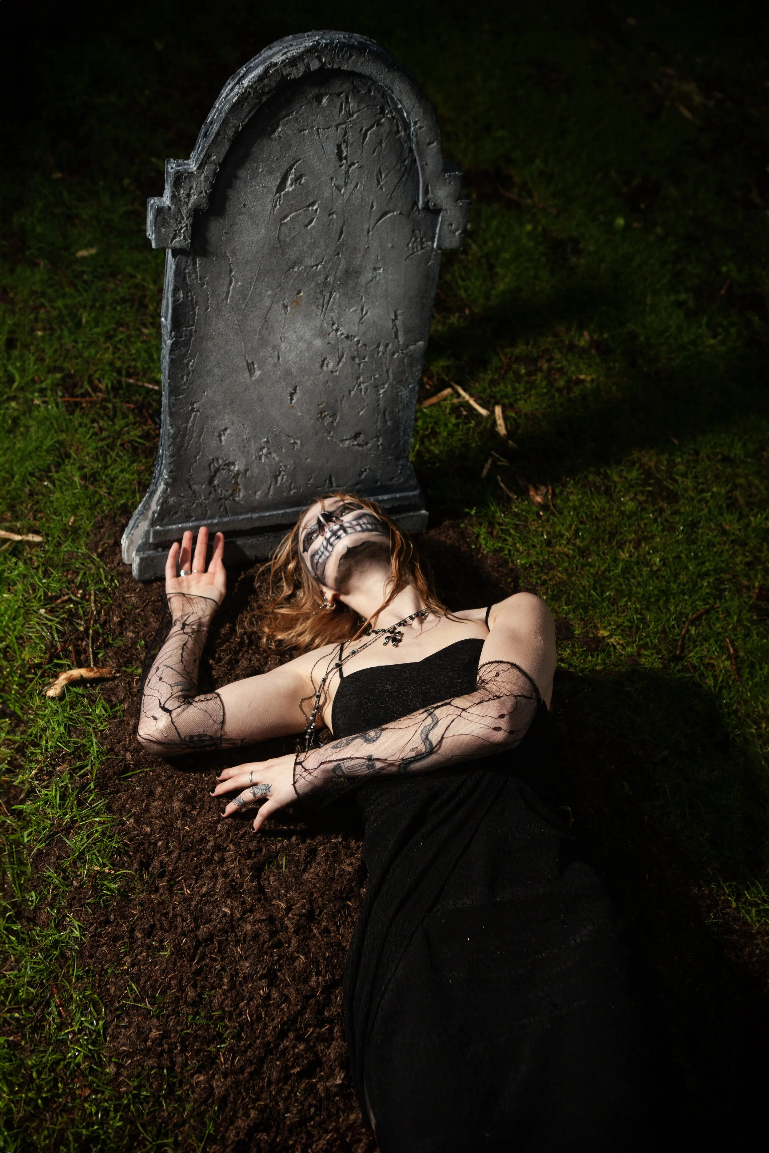 Surreal Photography including a woman in skeletal makeup around a grave