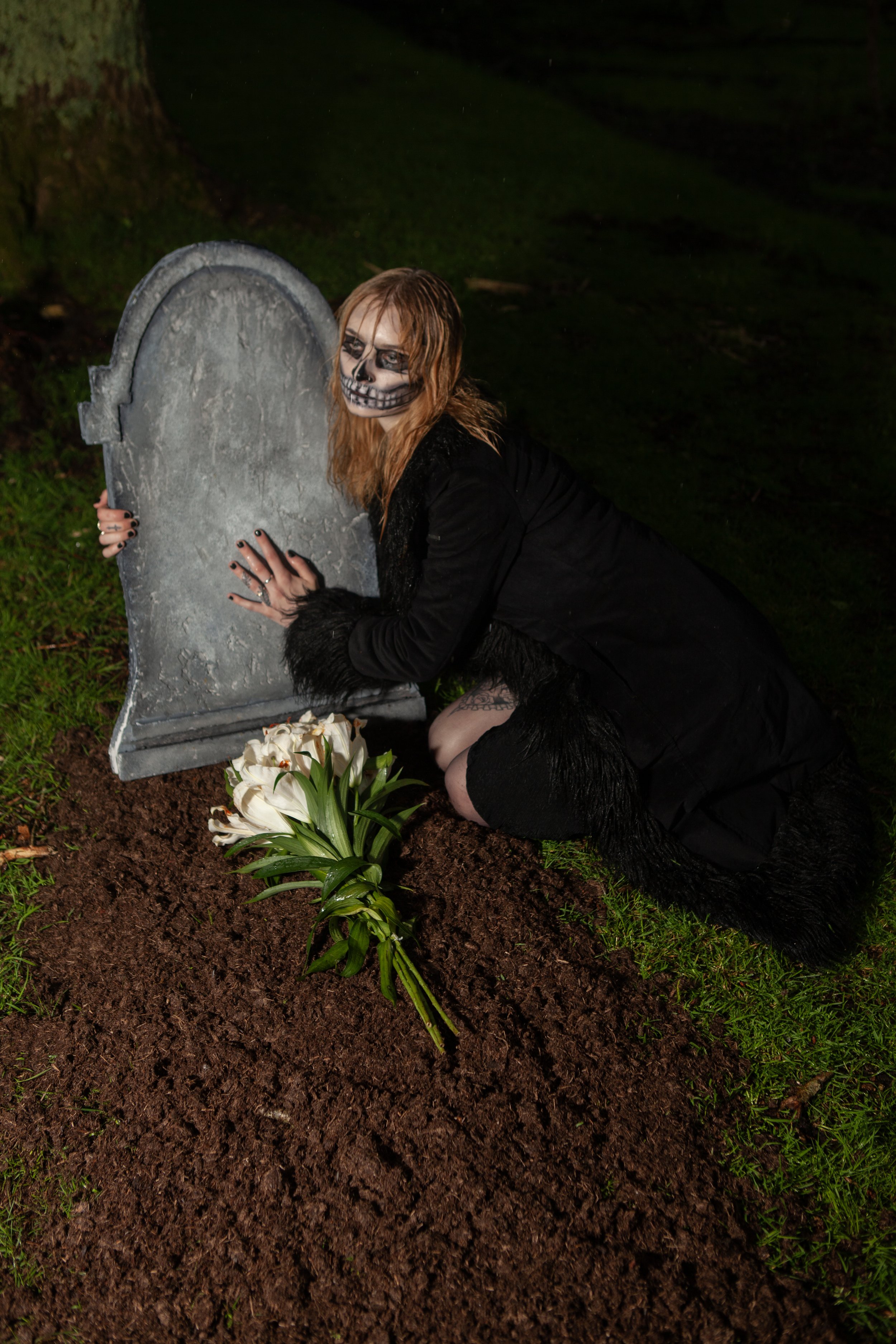 Surreal Photography including a woman in skeletal makeup around a grave
