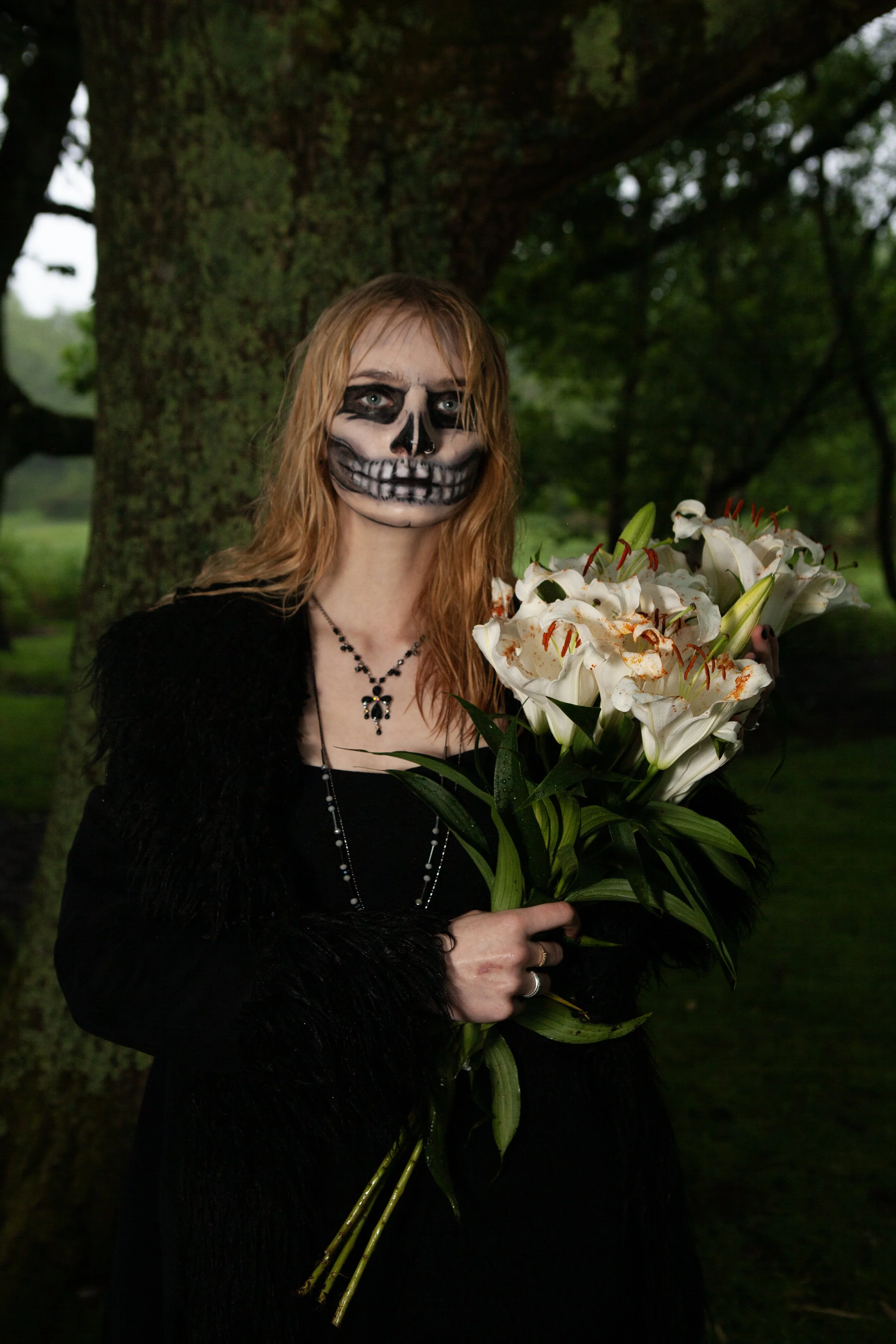 Surreal Photography including a woman in skeletal makeup around a grave