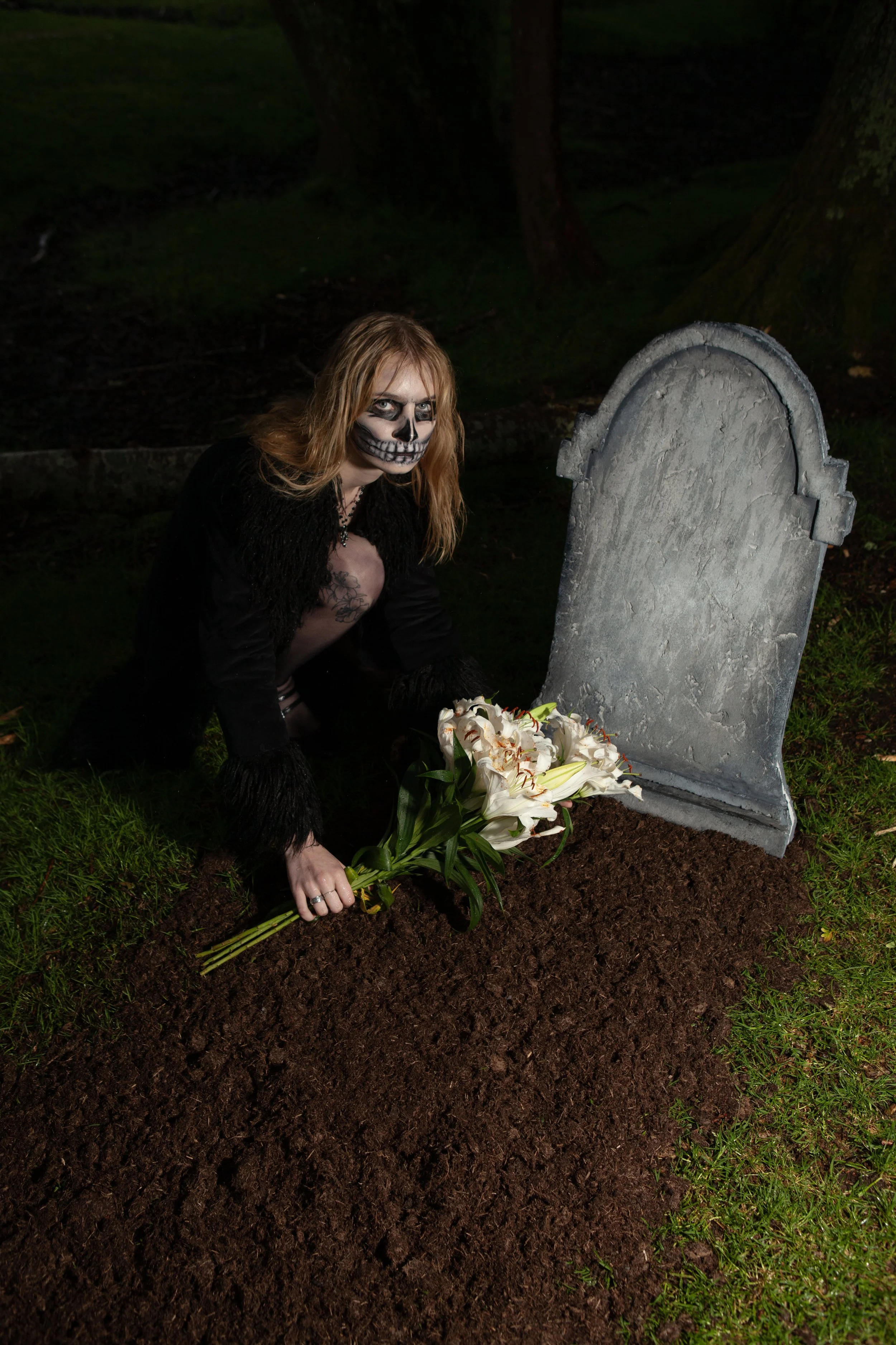 Surreal Photography including a woman in skeletal makeup around a grave