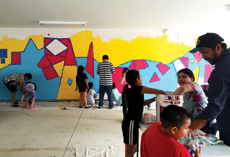 Mural painting community event at Lucero
