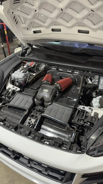 Porsche Cayenne Turbo S with twin red high-flow air filters replacing the factory airboxes at Custom Luxury Lab in Frisco, TX