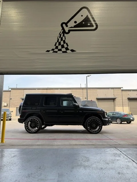 Mercedes-Benz Matte Black 2026 G63 with upgraded wheel install and body kit install in progress. 