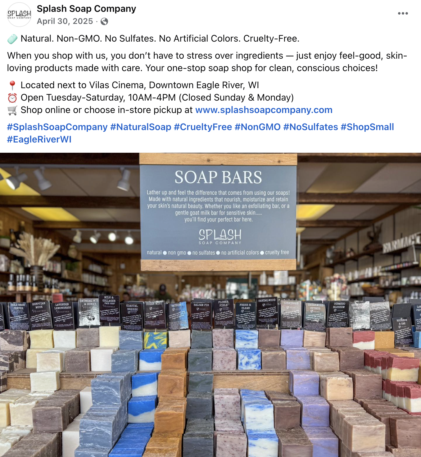 Display of various soap bars arranged on shelves at Splash Soap Company store, with a sign promoting natural, cruelty-free, and sulfate-free soap products.