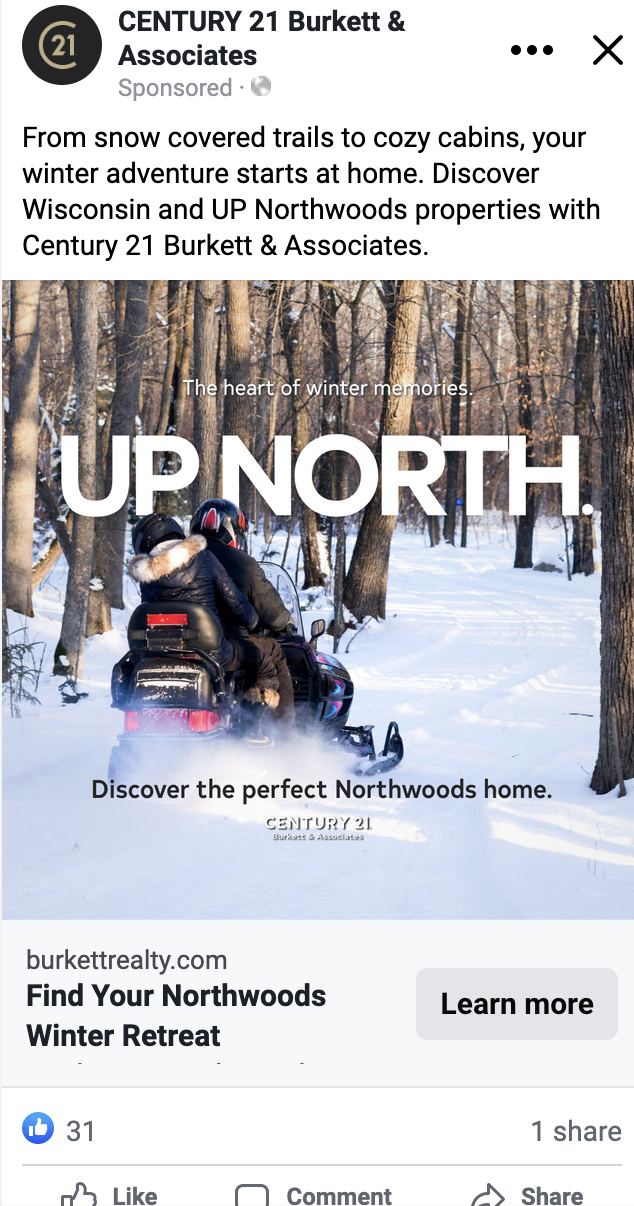 A snow-covered forest with a couple riding a snowmobile on a trail, surrounded by trees. Text overlay reads "UP NORTH."