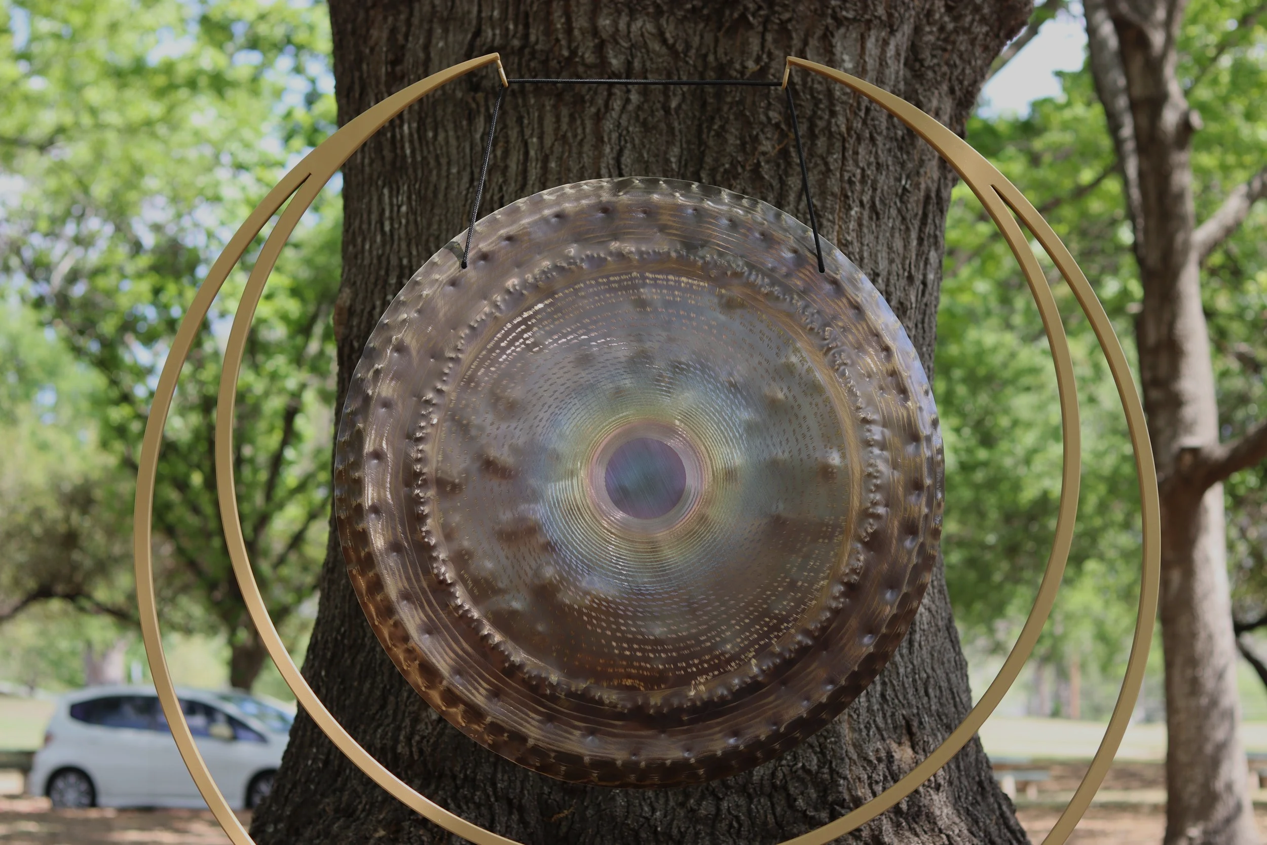 Large gong used for sound healing and sound bath experiences in Austin, TX.