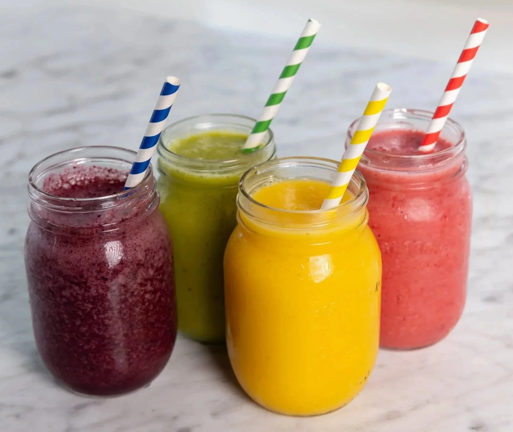 Four smoothies in mason jars At Fancy Pants Cafe in Bridgewater, Nova Scotia
