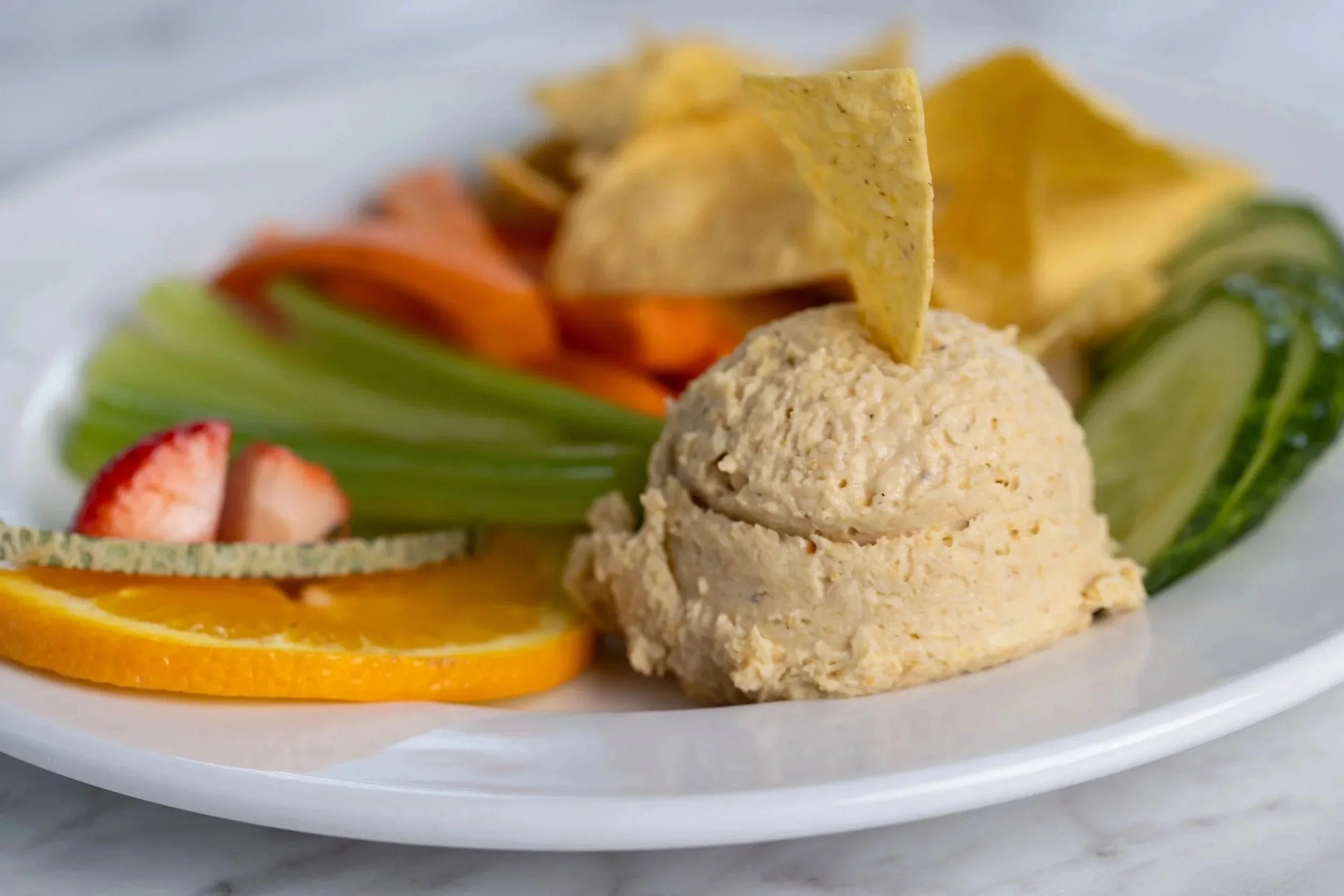 Hummus plate with veggies, organic tortilla chips and fresh fruit At Fancy Pants Cafe in Bridgewater, Nova Scotia