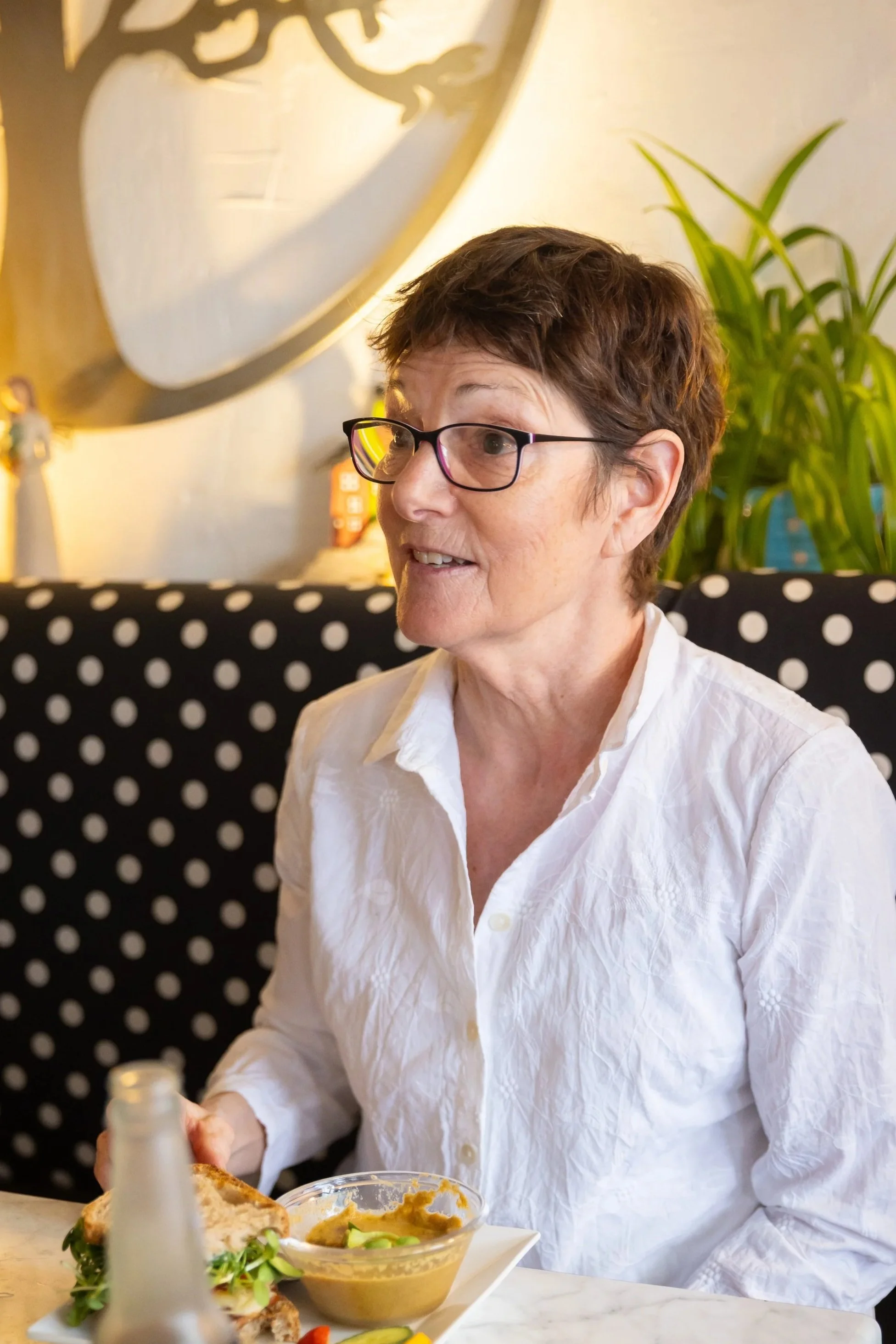 A dining patron holds a conversation during a meal at Fancy Pants Cafe in Bridgewater, NS