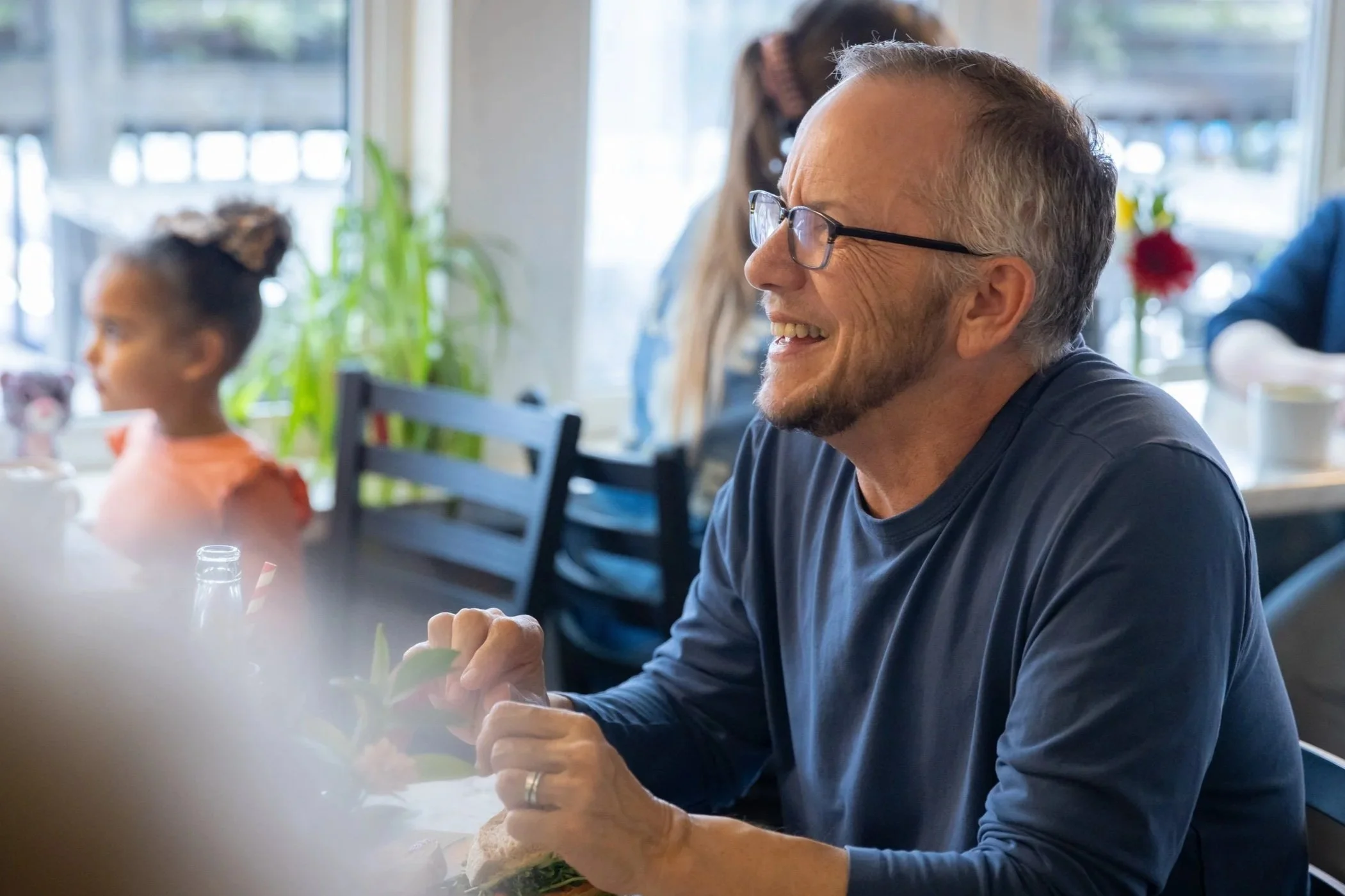 A diner smiles as he enjoys his meal at Fancy Pants Cafe in Bridgewater, NS