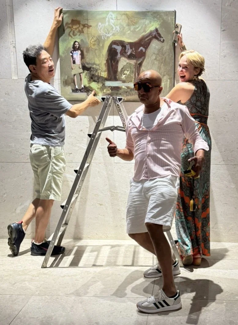 Erin McGee Ferrell installing her painting at Jeju Art for Earth, Jeju Shinhwa World, South Korea, September 2025.