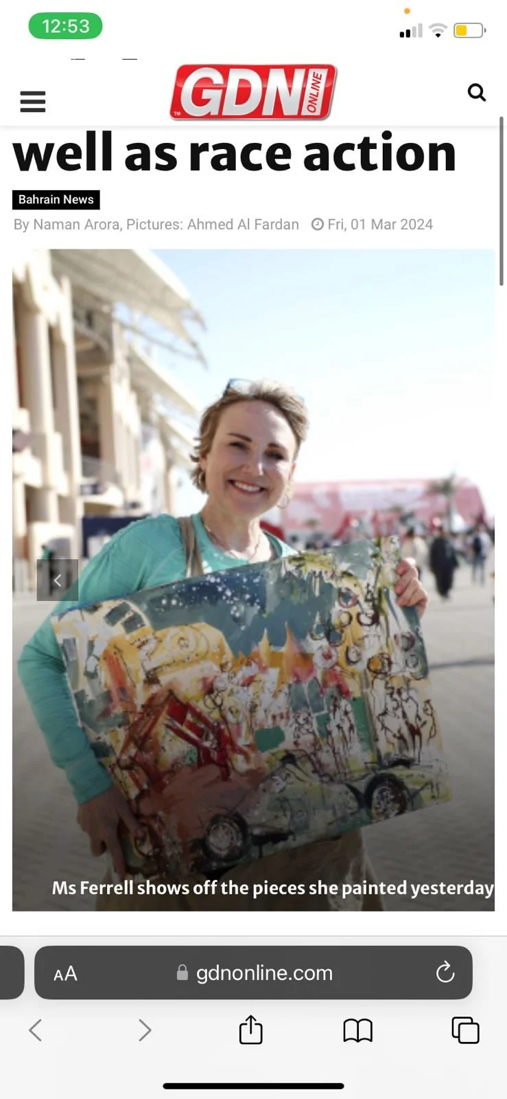 Erin McGee Ferrell with her paintings at the Bahrain Grand Prix, Bahrain International Circuit. Gulf Daily News, March 1, 2024. Photograph: Ahmed Al Fardan.