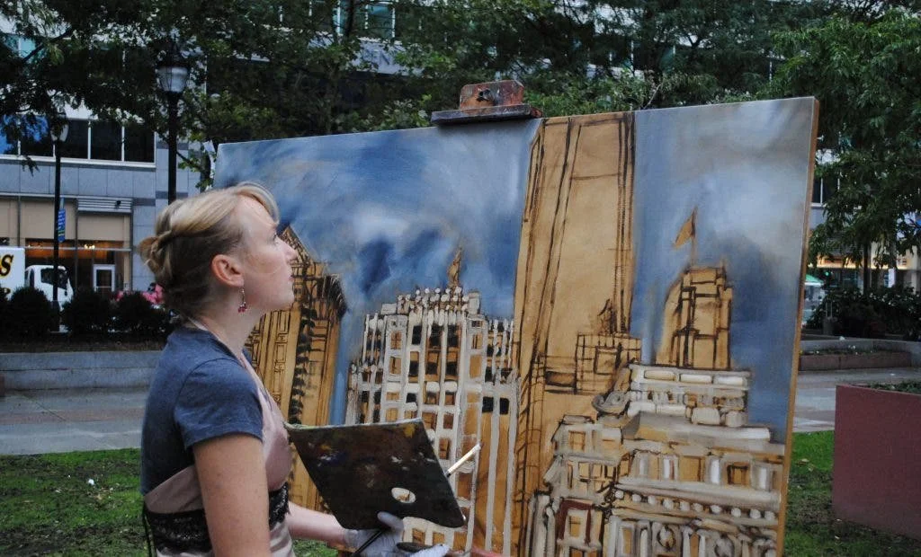Erin McGee Ferrell painting outdoors. Photograph published in Moorestown Patch, October 24, 2012.