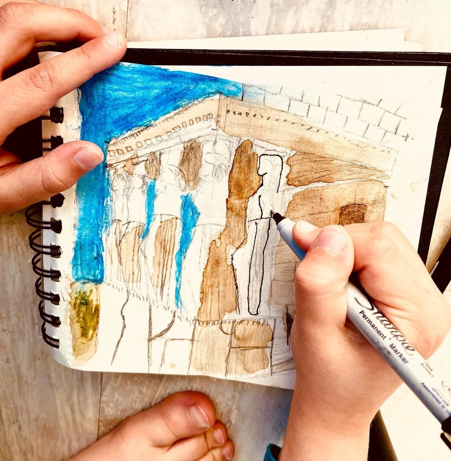 Erin’s student sketching the Caryatids at the Acropolis during a private art lesson with Erin McGee Ferrell, Athens, Greece, 2022.