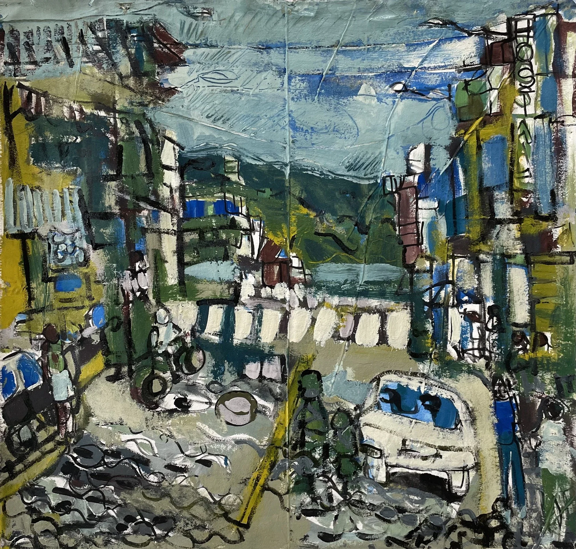 Erin McGee Ferrell — a street in Tena, Ecuador, with a white car, colorful buildings, overhead wires, and green hills.