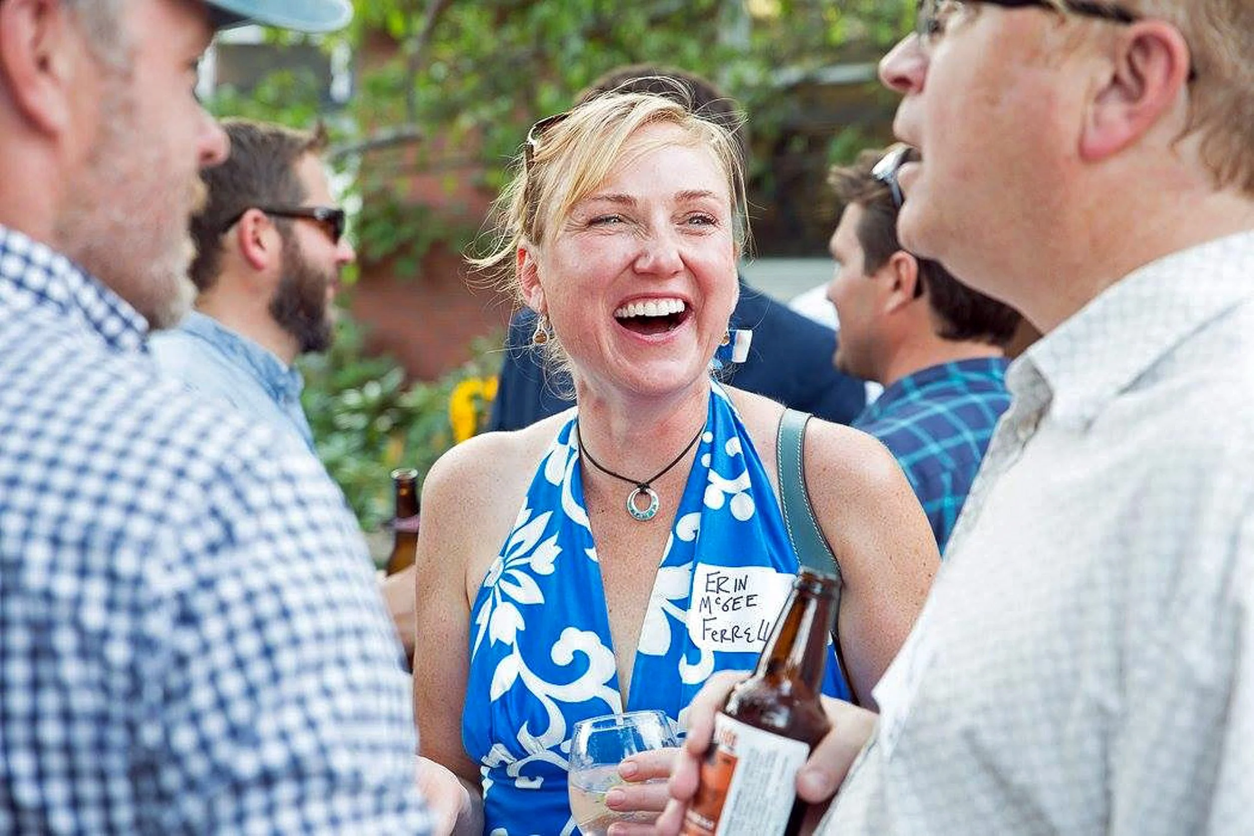 Erin McGee Ferrell in conversation at an outdoor gathering.