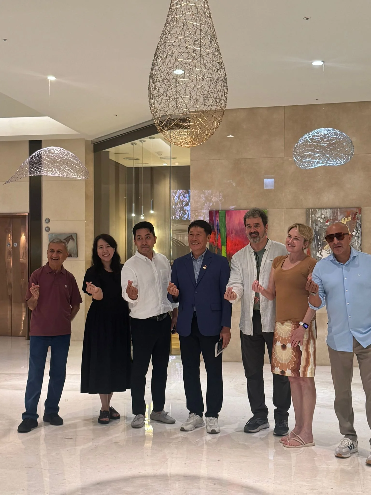 Artists and guests, including Erin McGee Ferrell, at the Jeju Art for Earth exhibition, Jeju Shinhwa World, South Korea, September 2025.