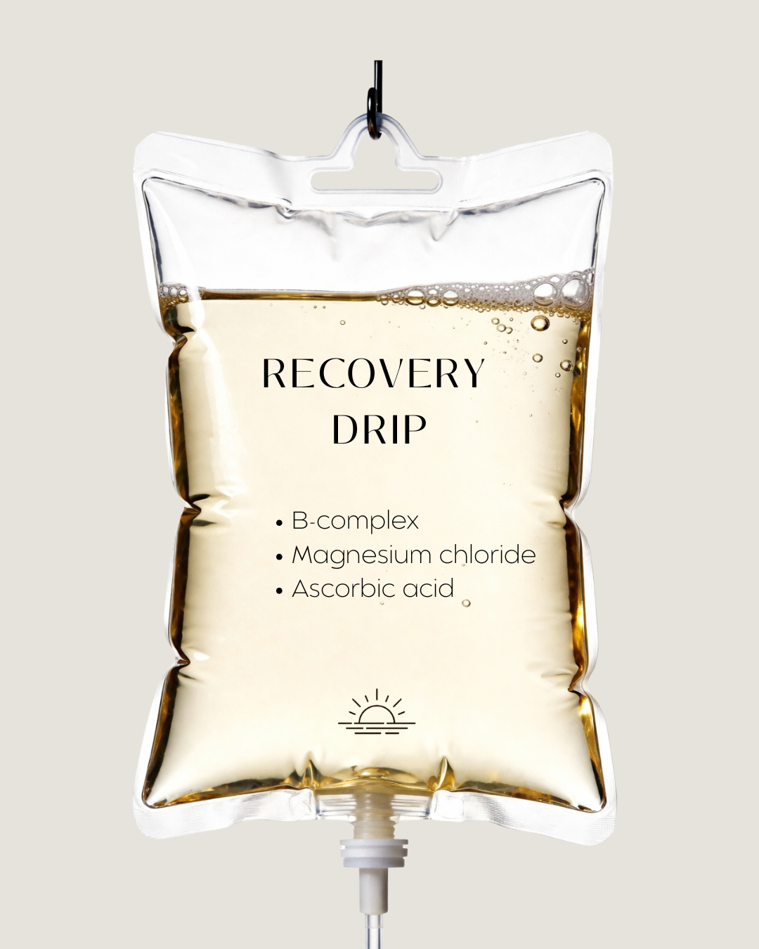 An IV drip bottle labeled 'Recovery Drip' containing a solution with ingredients listed as B-complex, magnesium chloride, and ascorbic acid, hanging against a plain background.