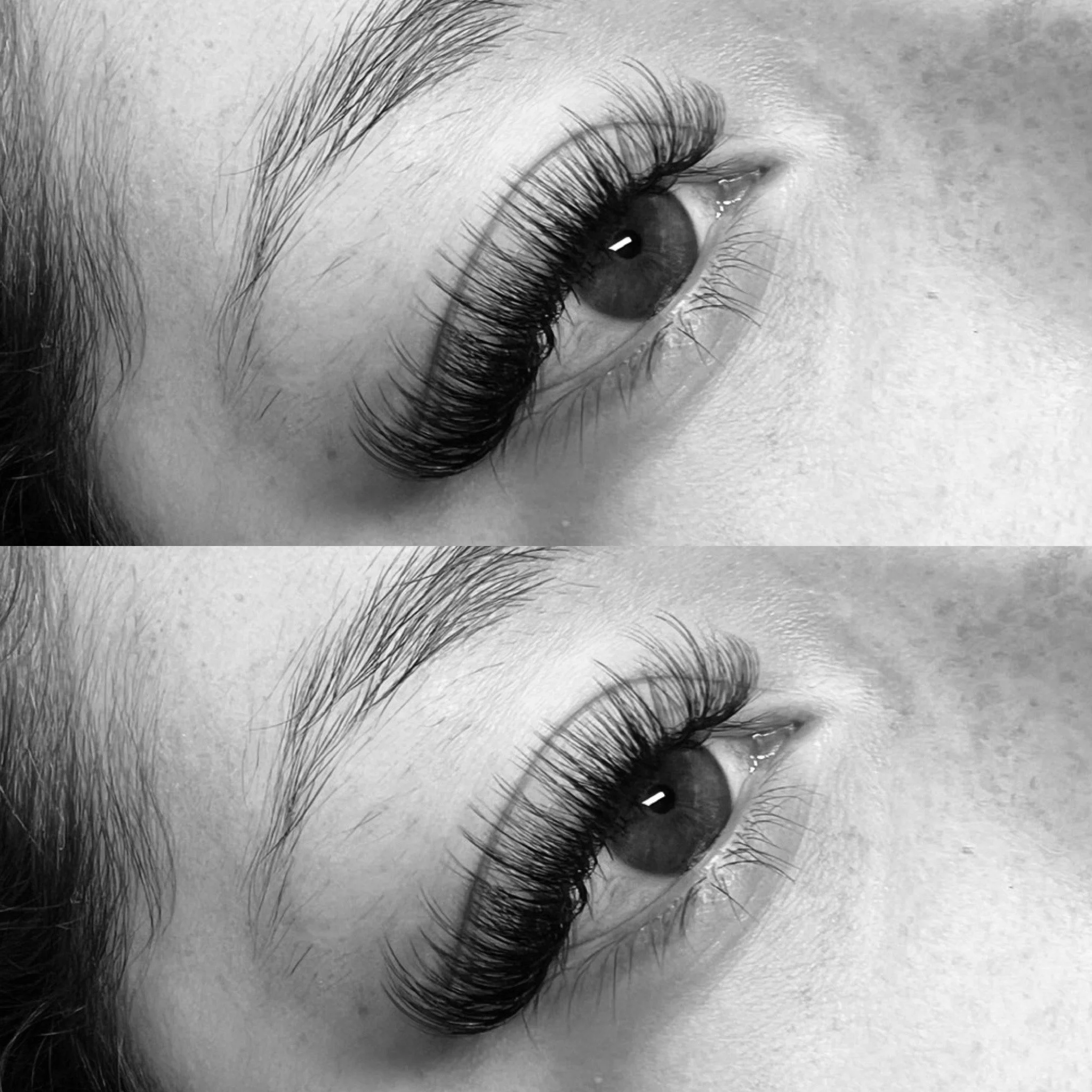 Close-up black and white photograph of a person's eye, showing detailed eyelashes, eyebrow, and surrounding skin.