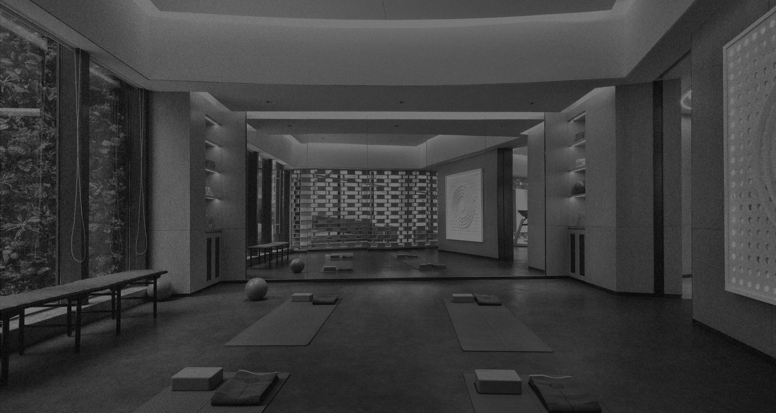 Indoor yoga or meditation studio with mats, cushions, and exercise balls, modern decor, large windows, and ambient lighting.