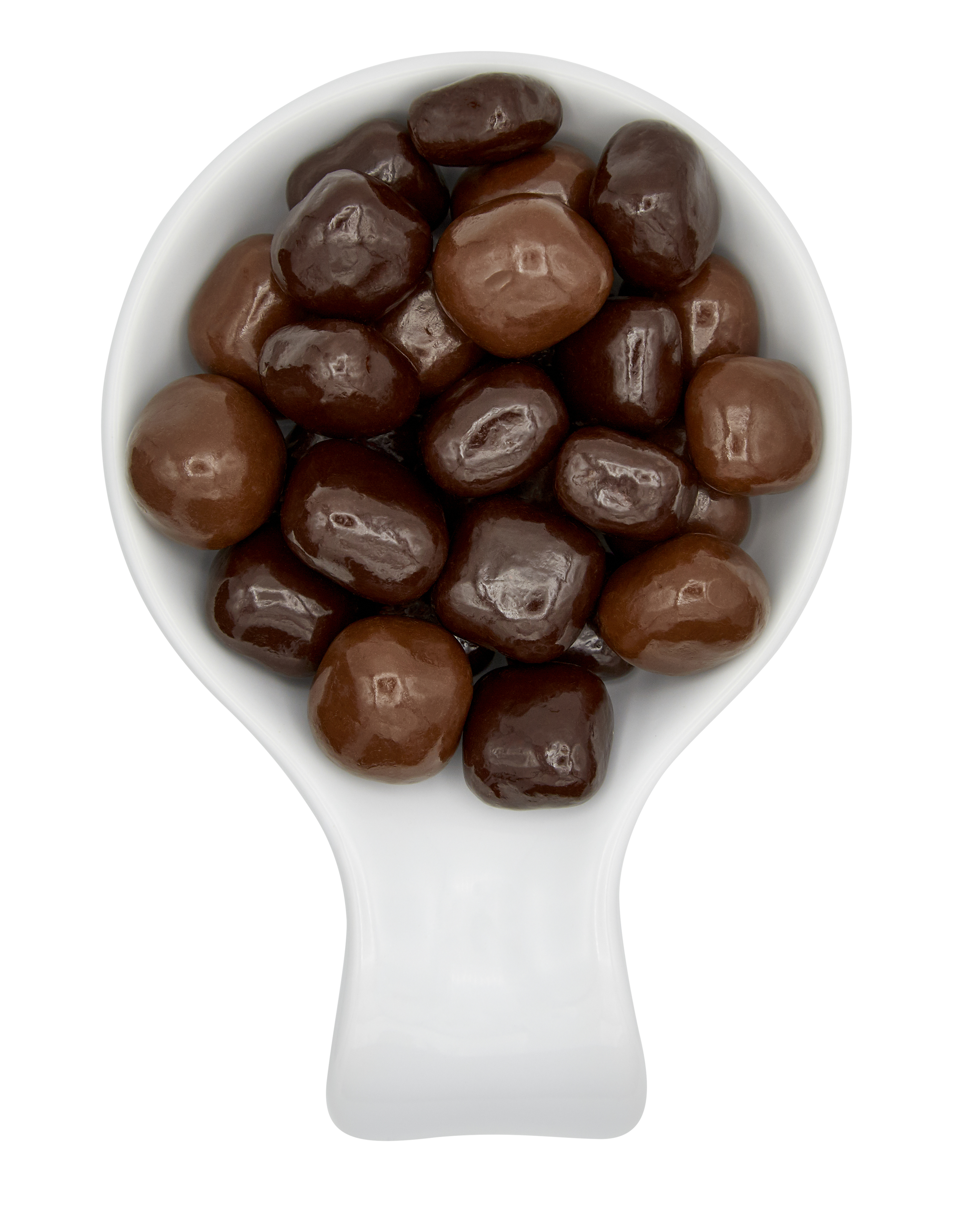 A white scoop filled with assorted chocolate-covered nuts or candies on a black and white background.
