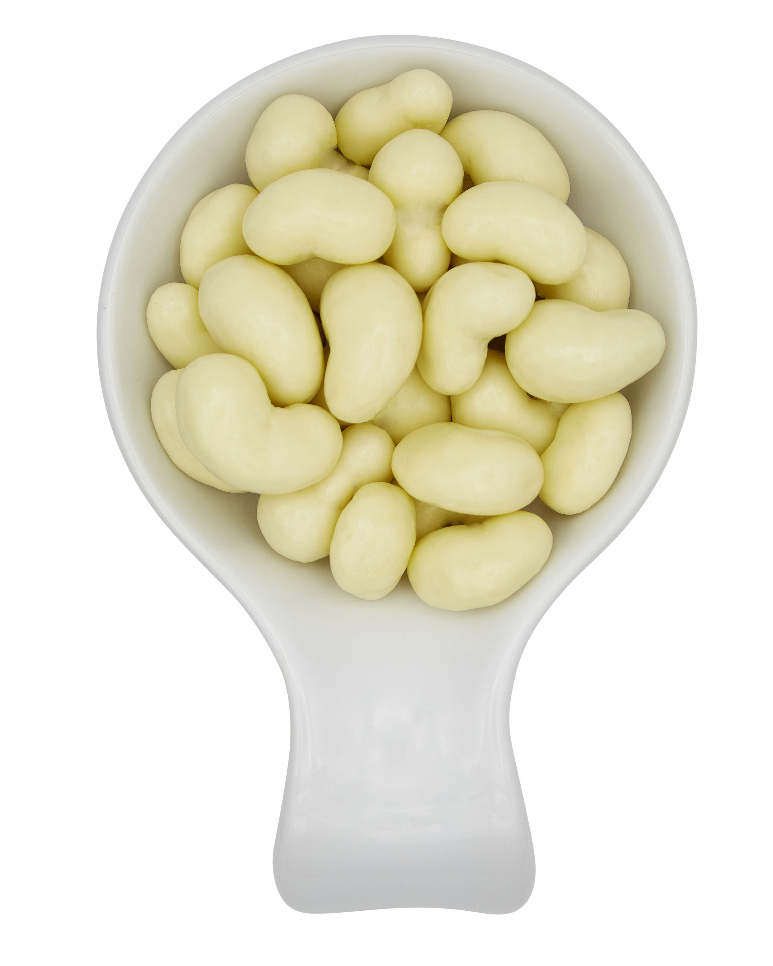 A white measuring scoop filled with white chocolate-covered nuts.