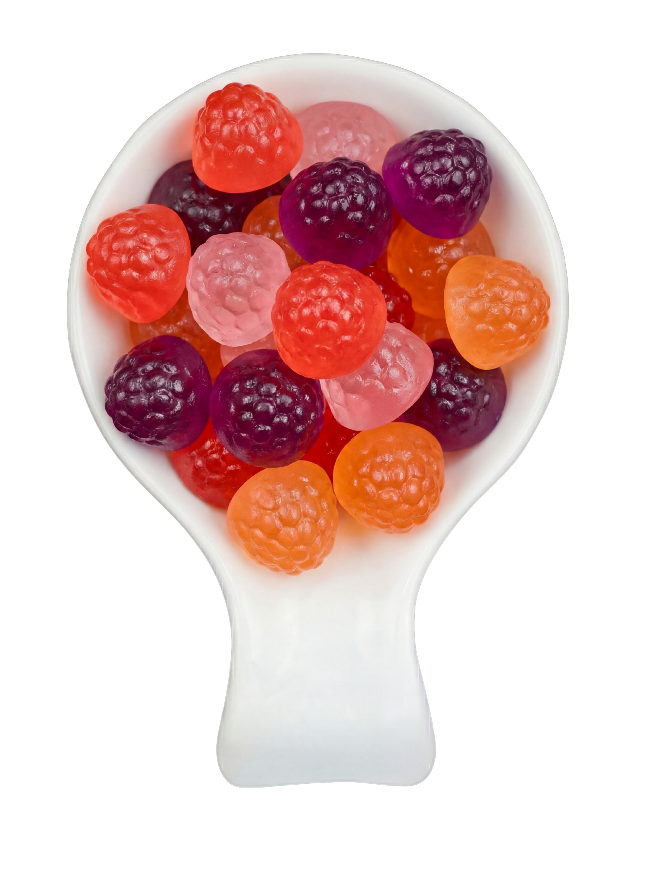 A white spoon filled with assorted colorful gummy candies shaped like raspberries and blackberries on a black background.