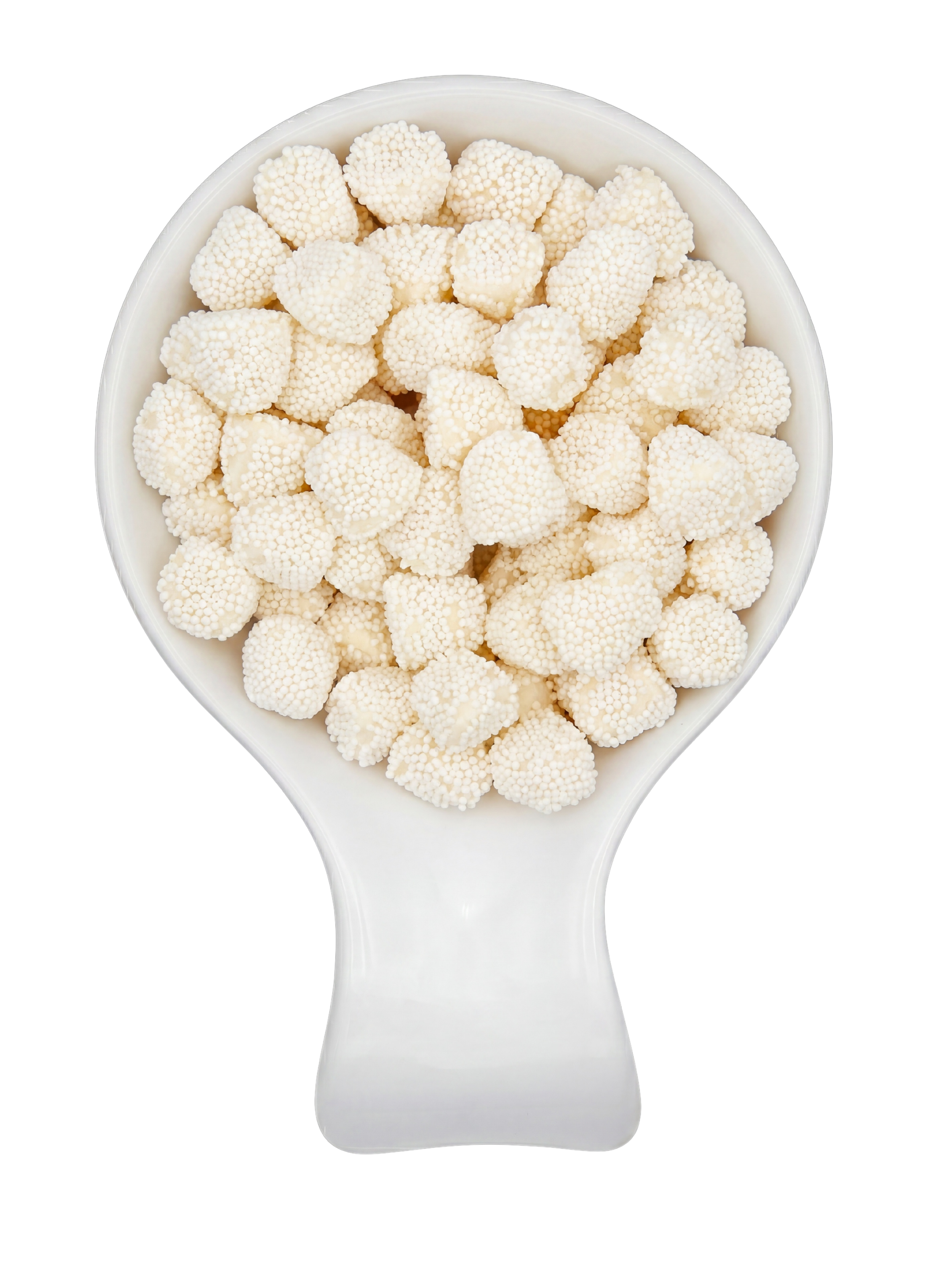 White opal gemstones in a white ceramic spoon against a black background.