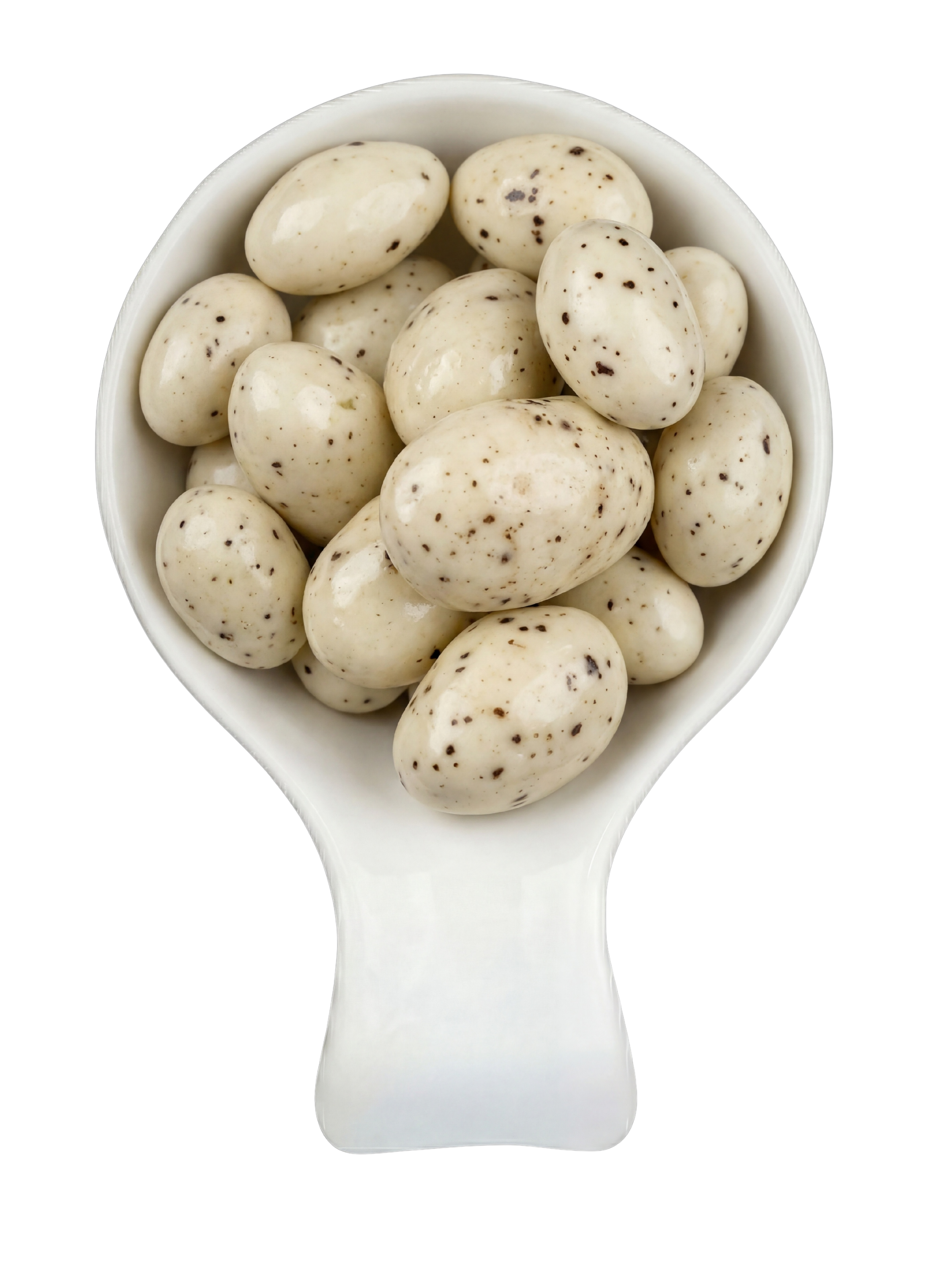 A white ceramic spoon filled with speckled, white eggs with black spots