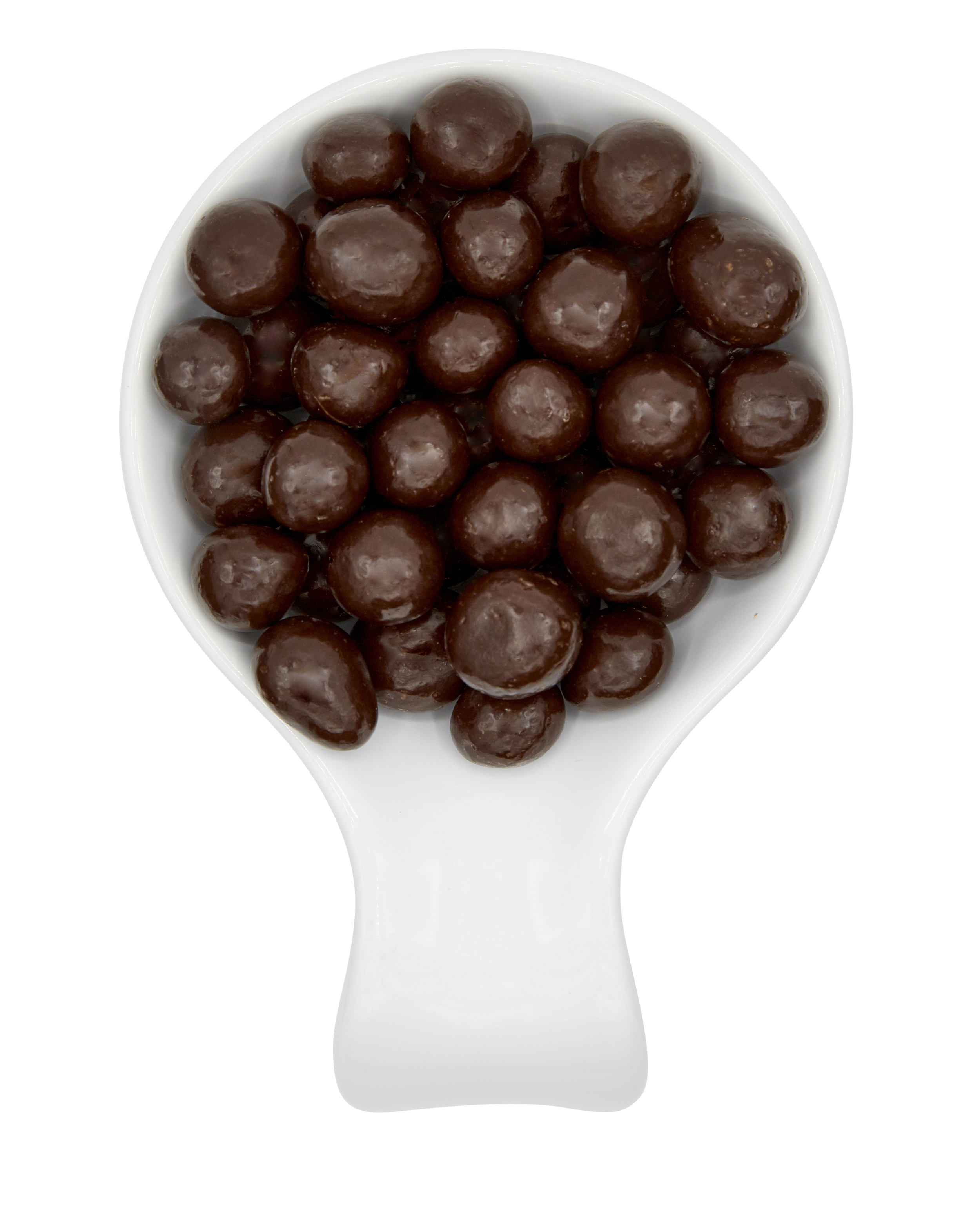 A white measuring scoop filled with chocolate-covered candies