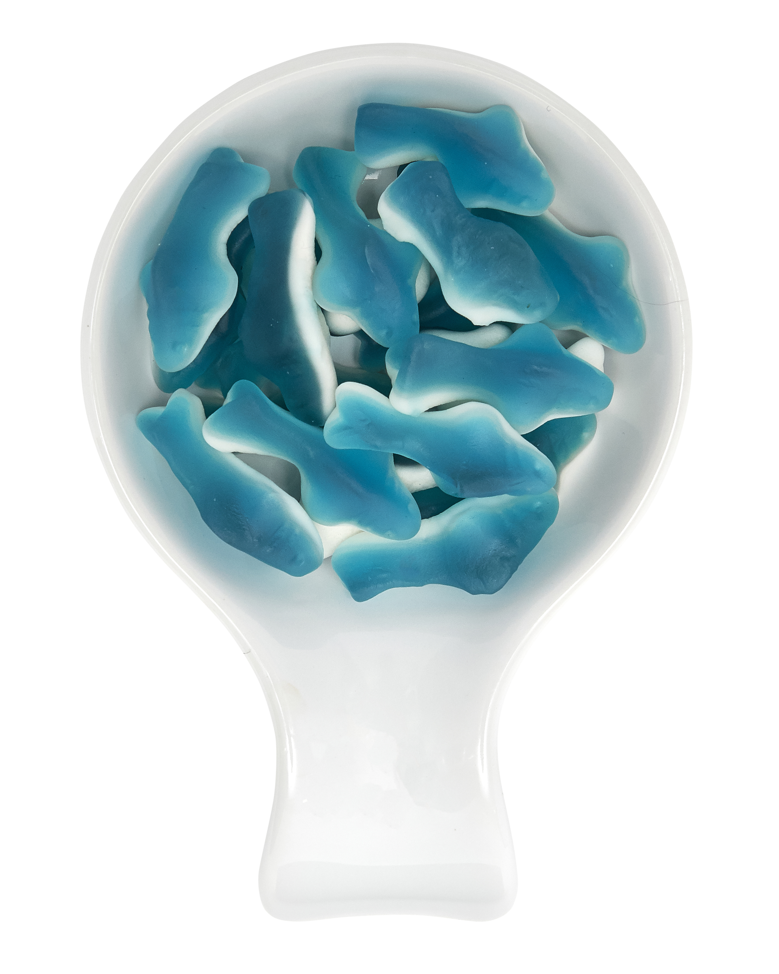 Blue and white gummy shark candies in a white spoon.