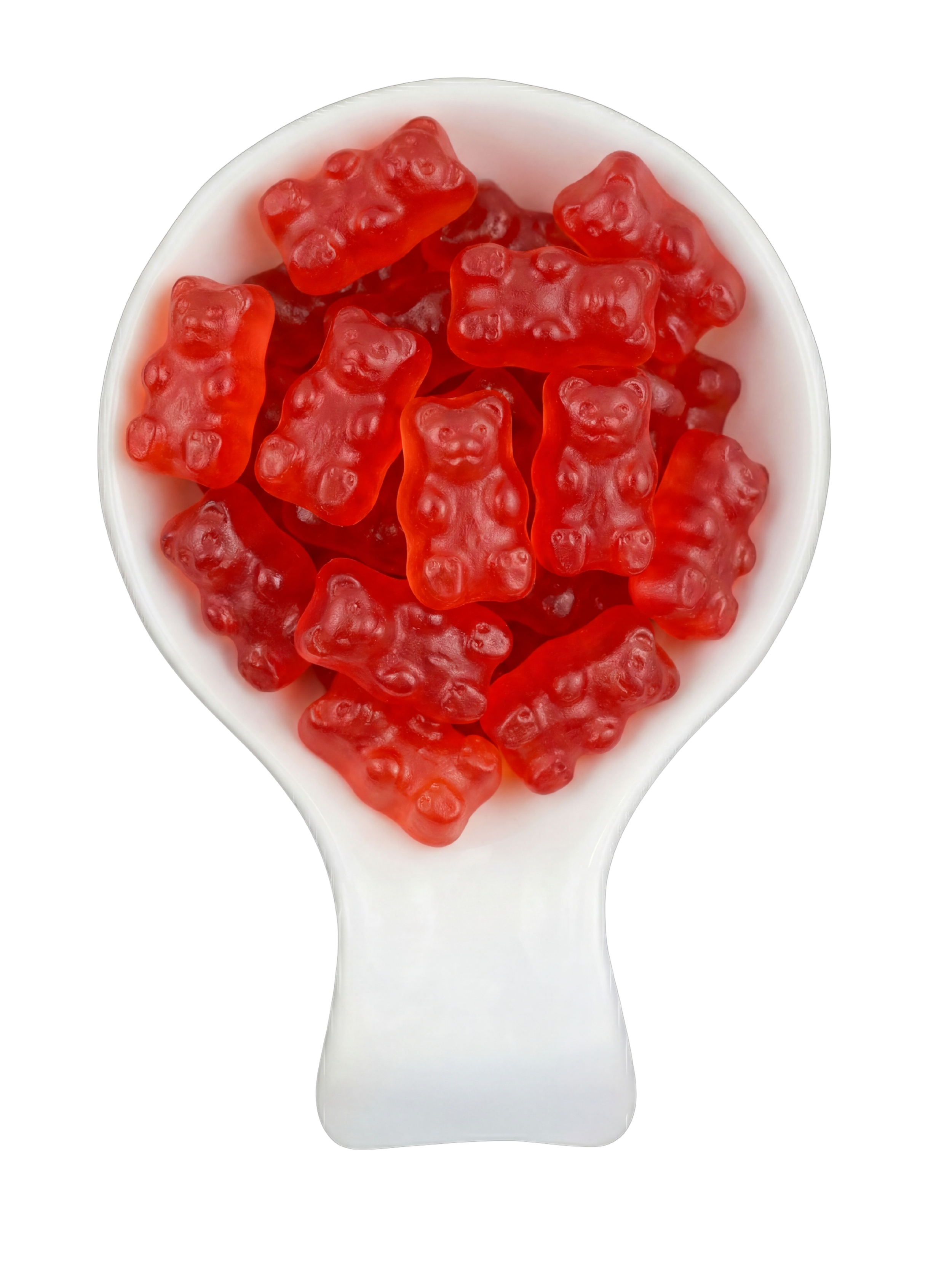 A white spoon filled with red gummy bears shaped like bears with smiling faces, set against a black background.