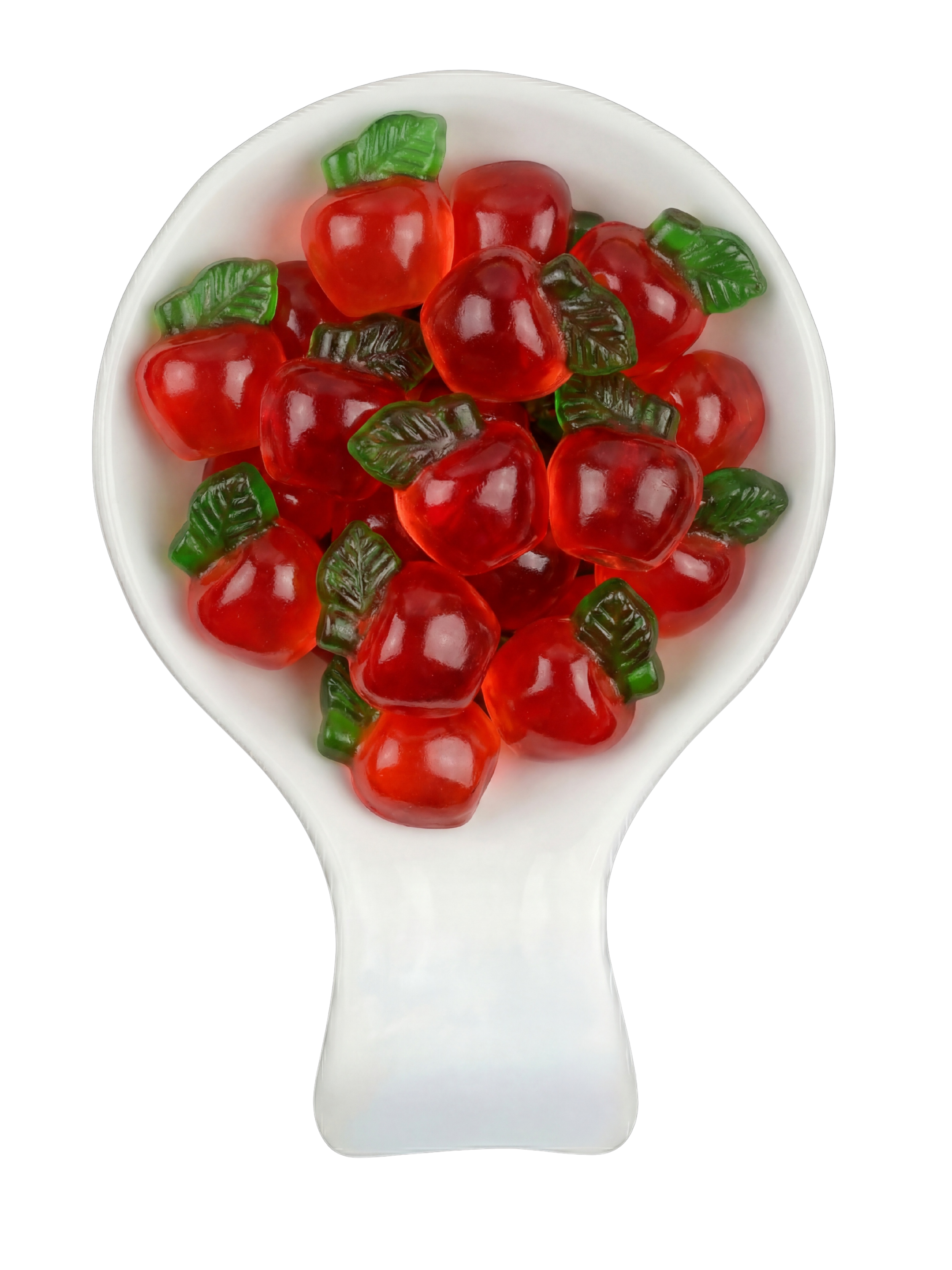 Close-up of artificial gummy candies shaped like red apples with green leaves, placed in a white spoon against a black background.