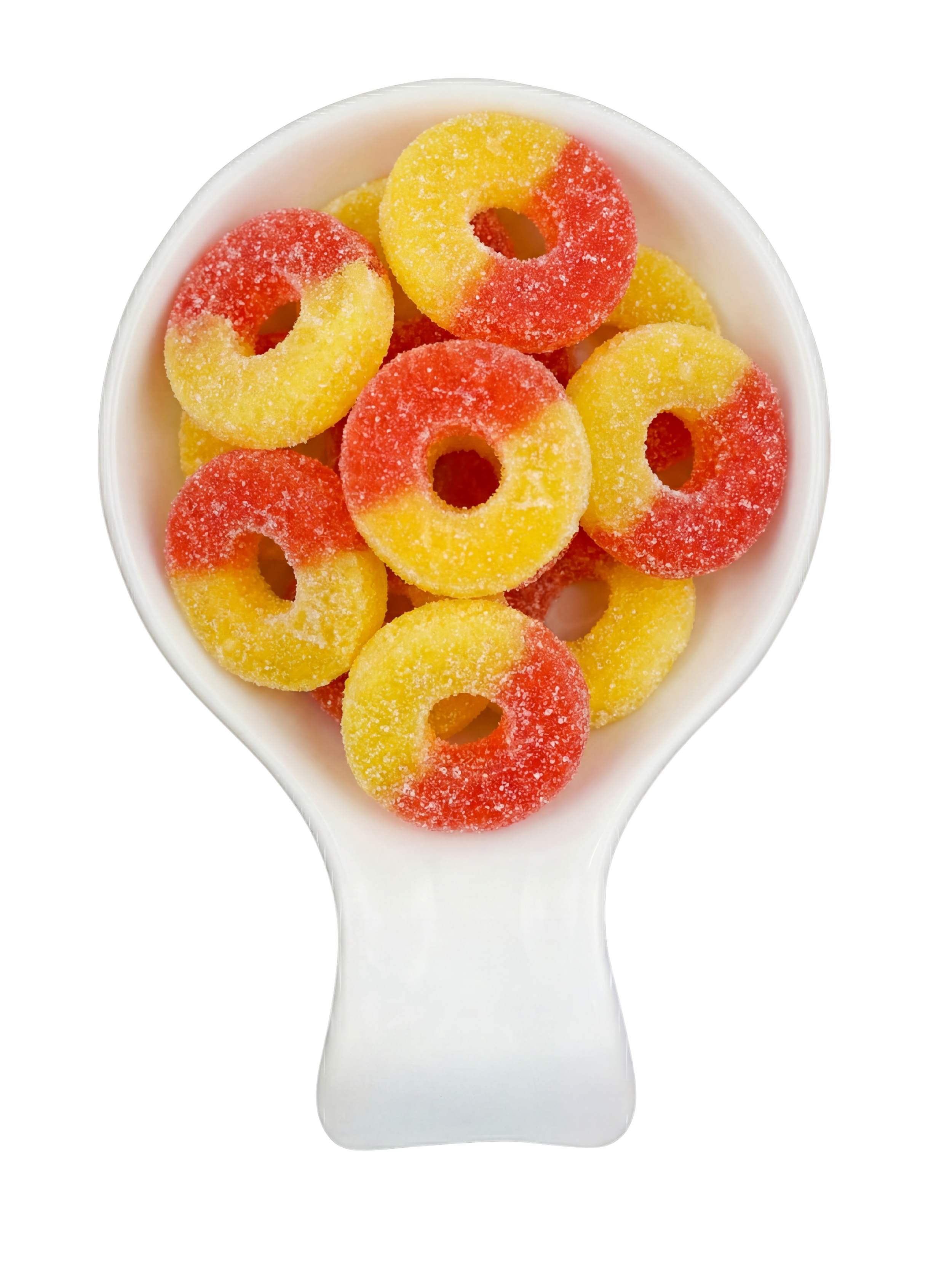 Colorful ring-shaped gummy candies covered in sugar in a white spoon against a black background.