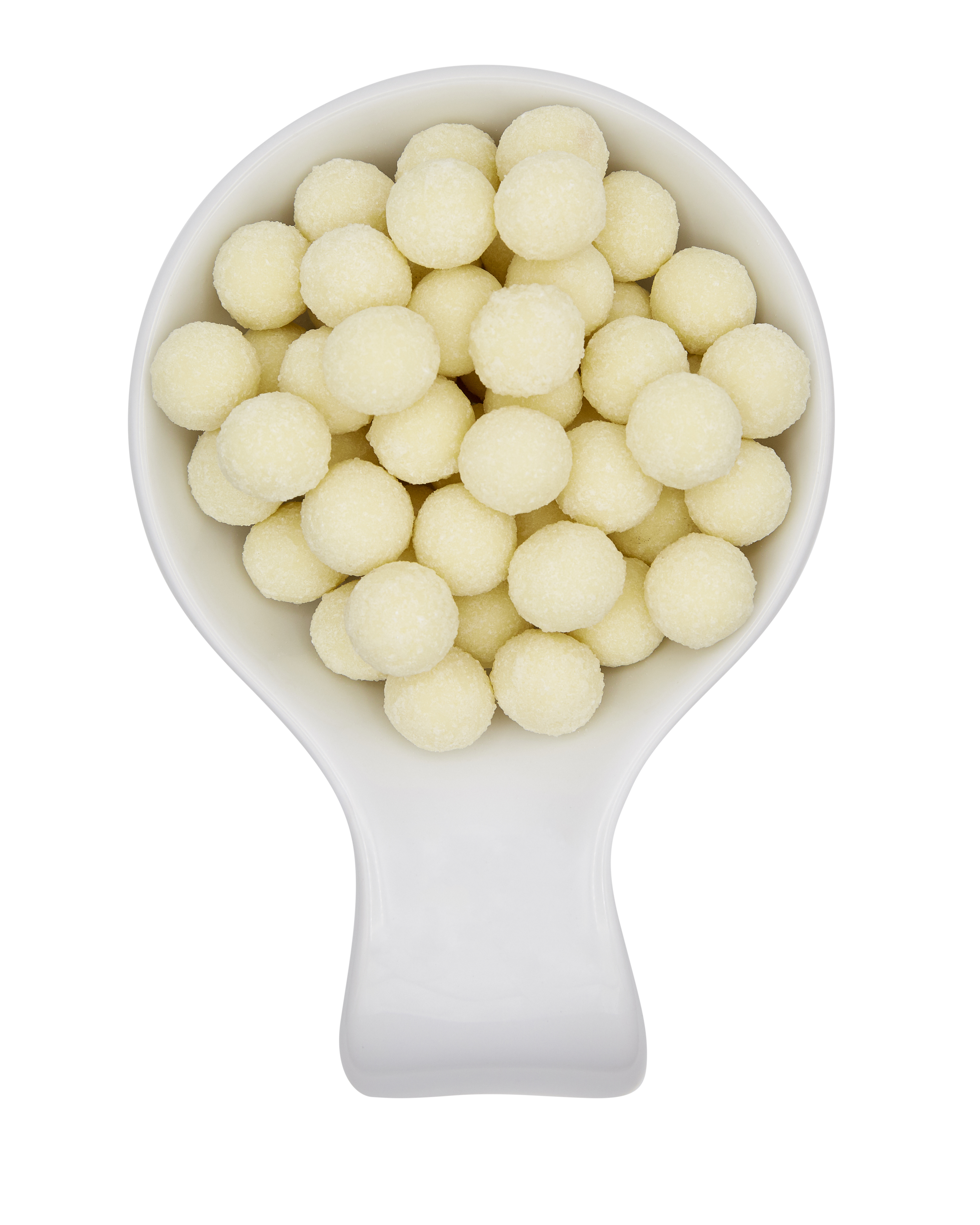 A white scoop filled with small, round, white candies or tapioca pearls against a black background.