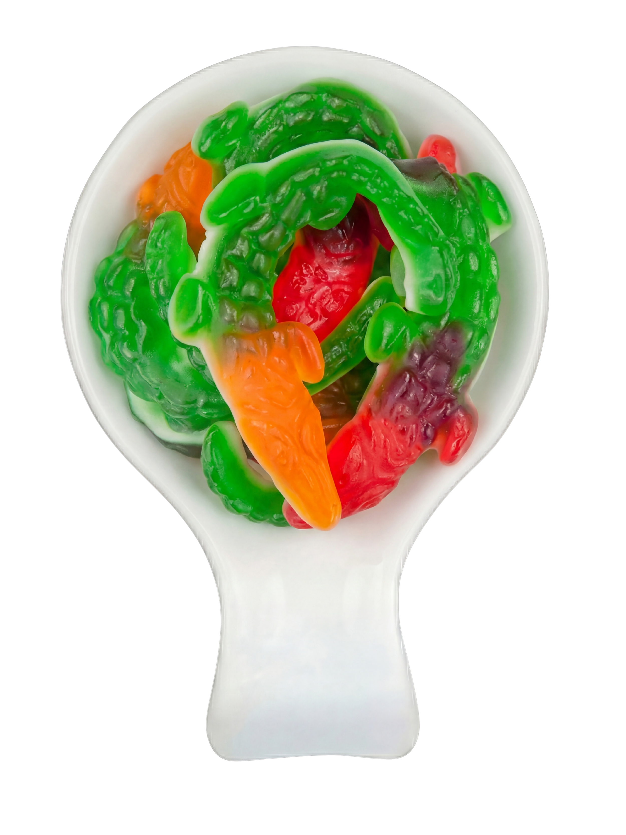 Colorful gummy candy shaped like peppers in a white spoon against a black background.