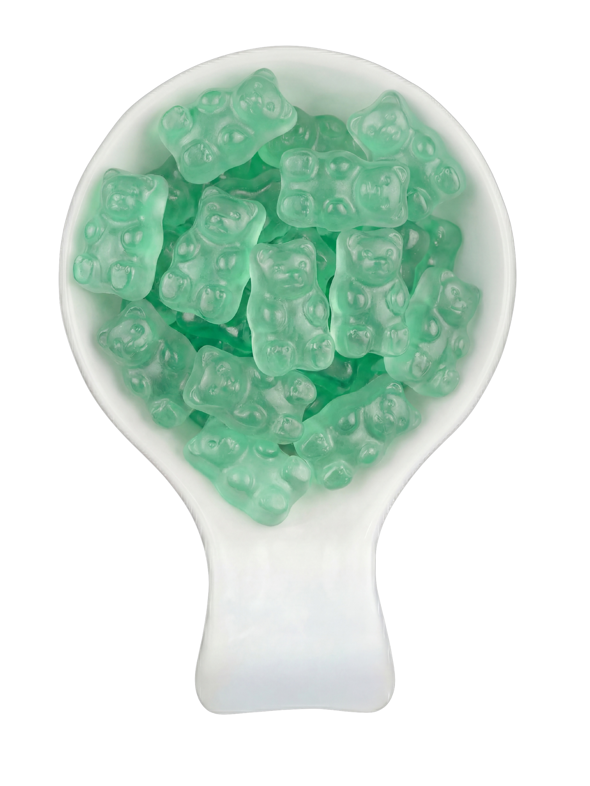 Close-up of a white spoon filled with gummy bear-shaped candies in light green color.