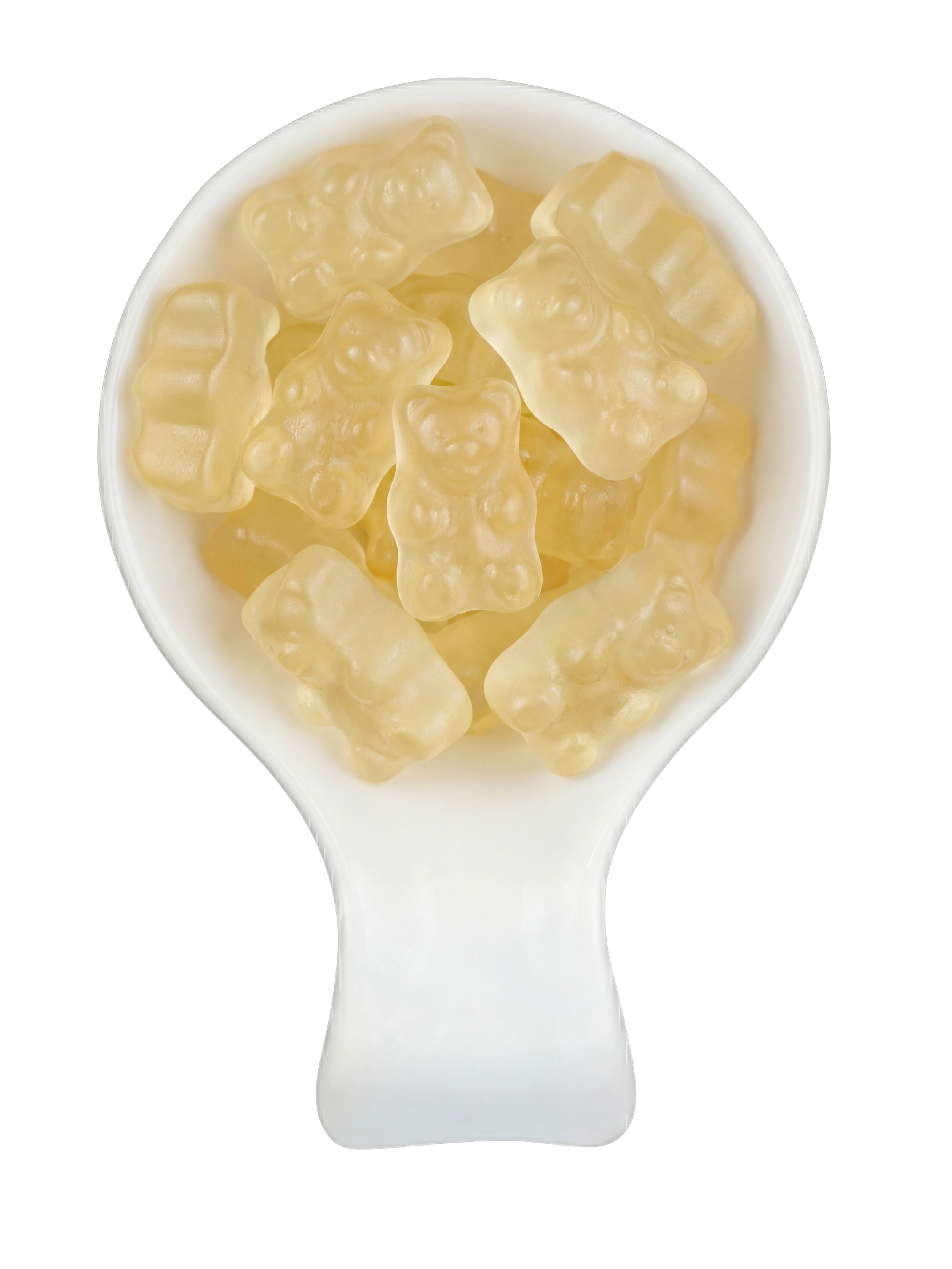 Close-up of a white spoon filled with gummy bear candies that are clear and yellowish, set against a black background.
