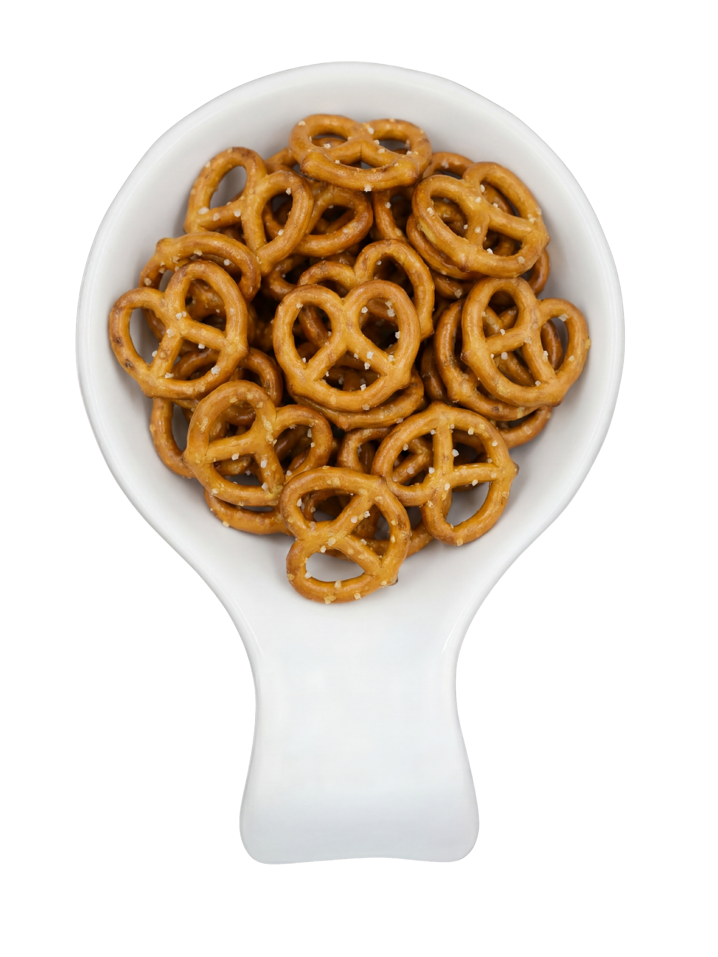 A white ceramic spoon filled with small pretzels sprinkled with salt, against a black background.