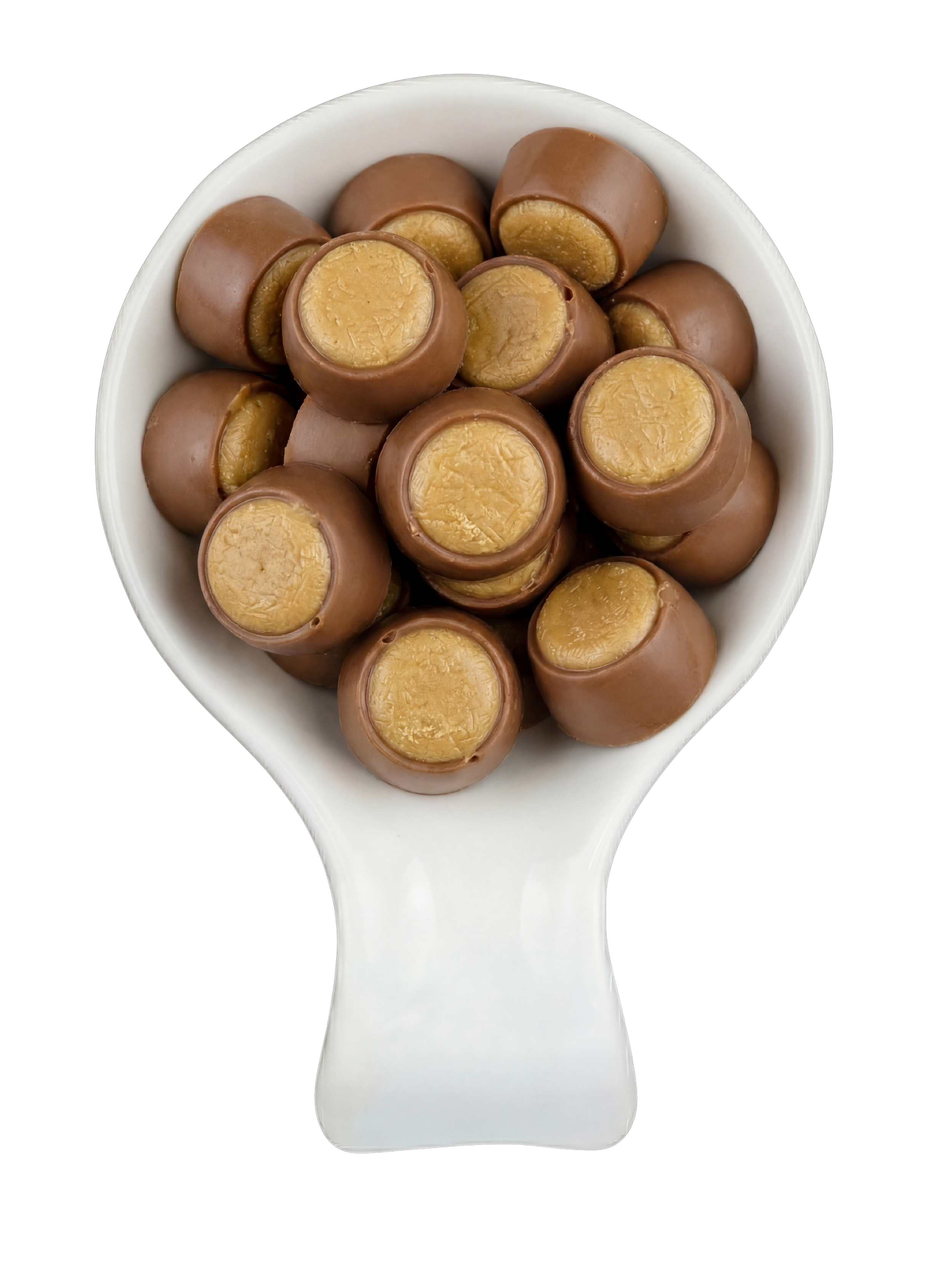 A white spoon filled with chocolate-covered caramel candies, with the caramel exposed at the centers, against a black background.