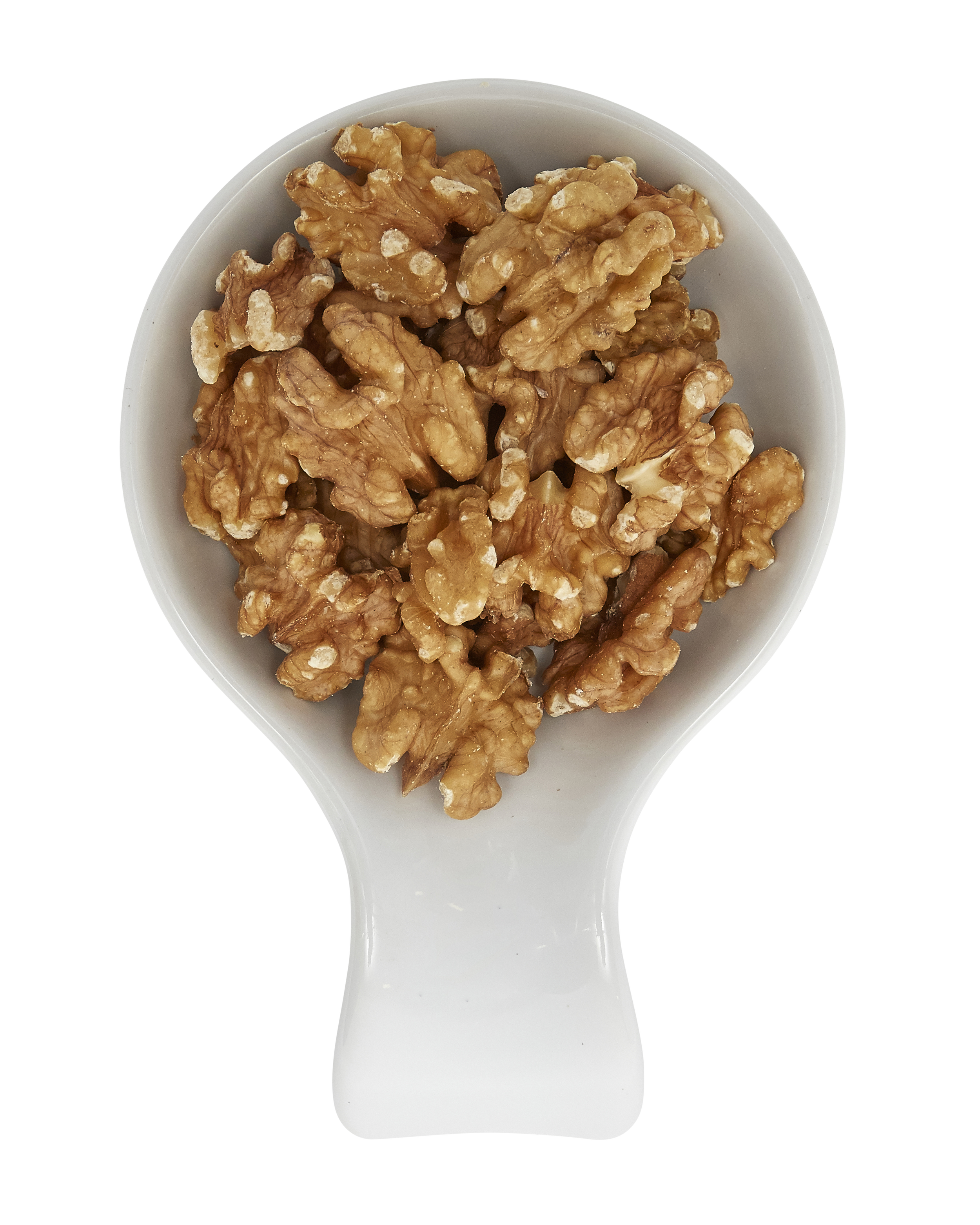 Roasted walnuts in a white bowl.